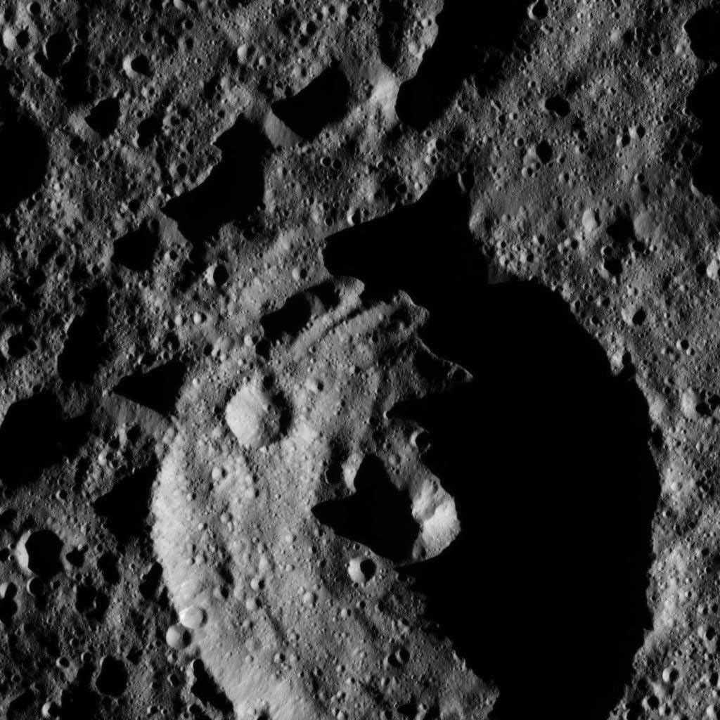 This view from NASA's Dawn spacecraft shows a crater in the southern hemisphere of Ceres with a prominent central peak. The image is centered at approximately 63 degrees south latitude, 143 degrees east longitude. Dawn captured the scene on Dec. 24, 2015.