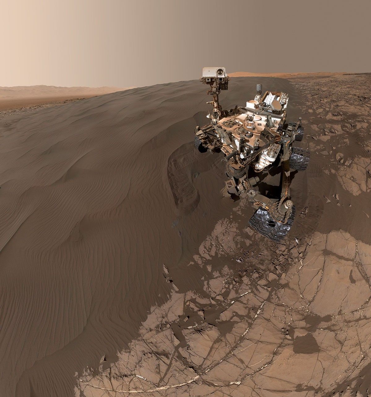 This self-portrait of NASA's Curiosity Mars rover shows the vehicle at 'Namib Dune,' where the rover's activities included scuffing into the dune with a wheel and scooping samples of sand for laboratory analysis.