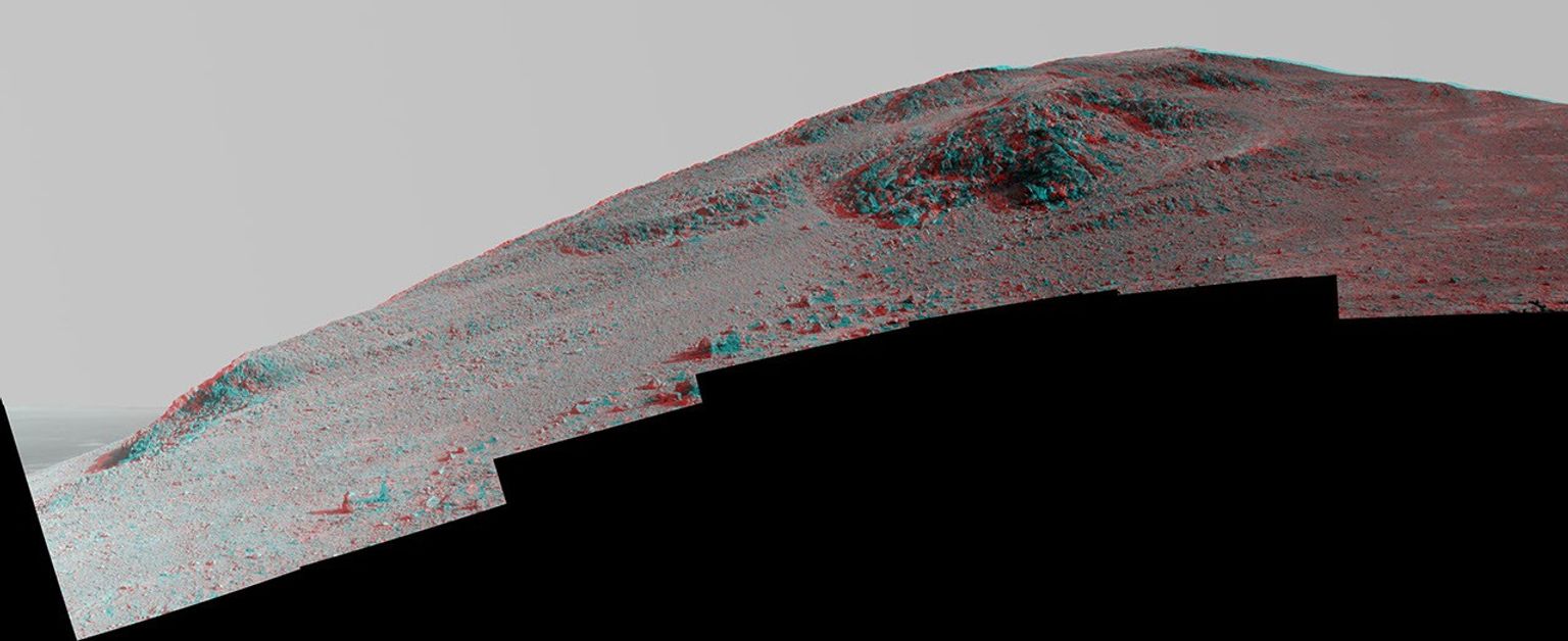 This stereo view from NASA's Mars Exploration Rover Opportunity looks upward at 'Knudsen Ridge' on the southern edge of 'Marathon Valley' from inside the valley. You need 3-D glasses to view this image.