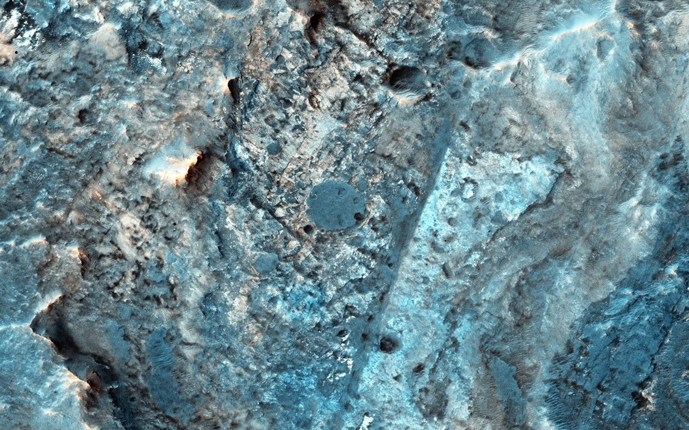 McLaughlin Crater (21.9 N, 337.6 E) is a large, approximately 95-kilometer diameter impact crater located north of Mawrth Vallis, in Arabia Terra, seen here by NASA's Mars Reconnaissance Orbiter spacecraft.