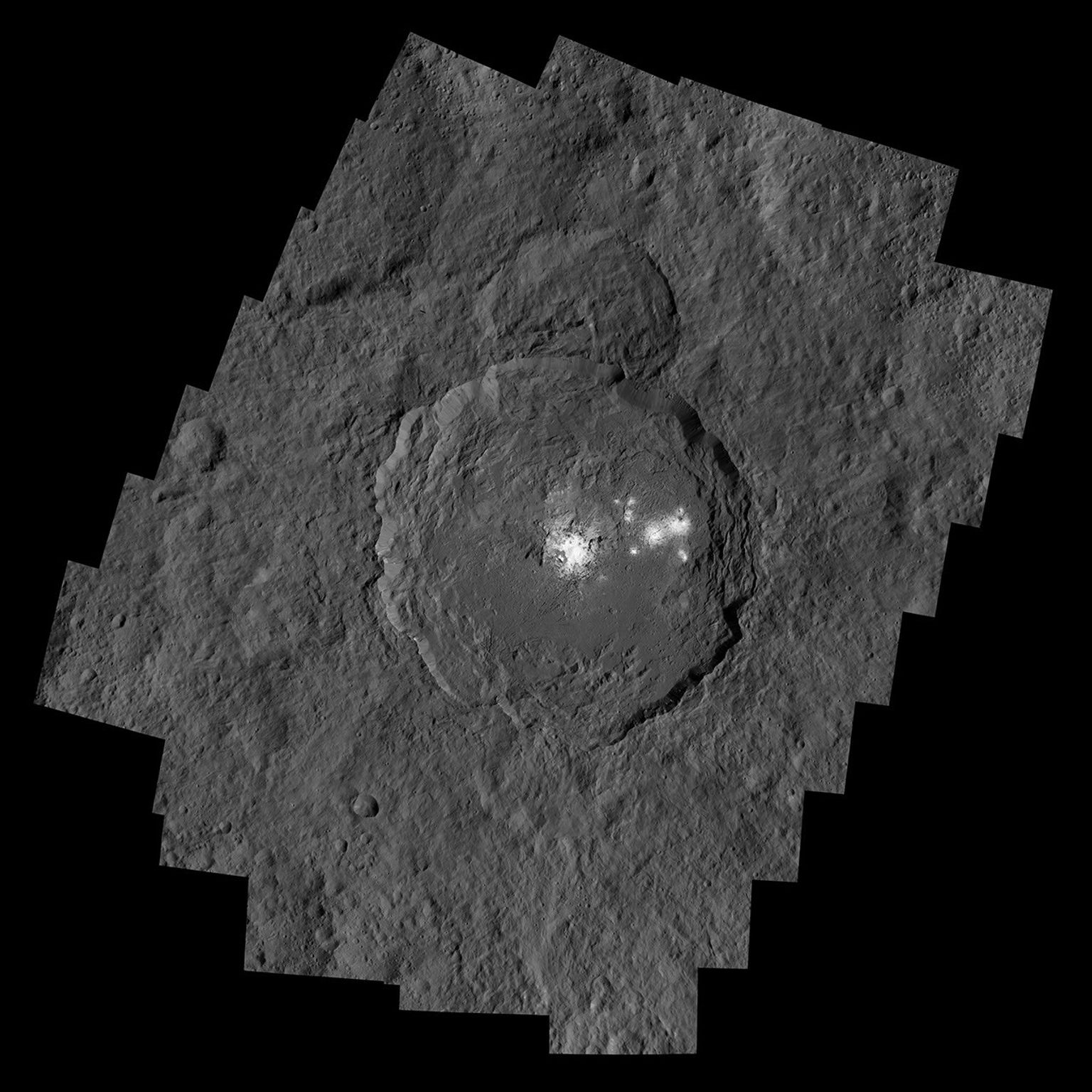 NASA's Dawn spacecraft captured Occator Crater, containing the brightest area on Ceres; this closeup reveals a dome in a smooth-walled pit in the bright center of the crater.