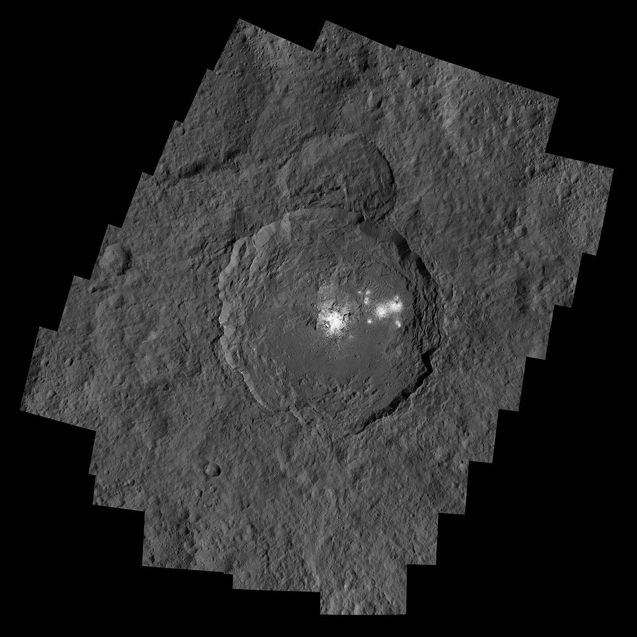 NASA's Dawn spacecraft captured Occator Crater, containing the brightest area on Ceres; this closeup reveals a dome in a smooth-walled pit in the bright center of the crater.