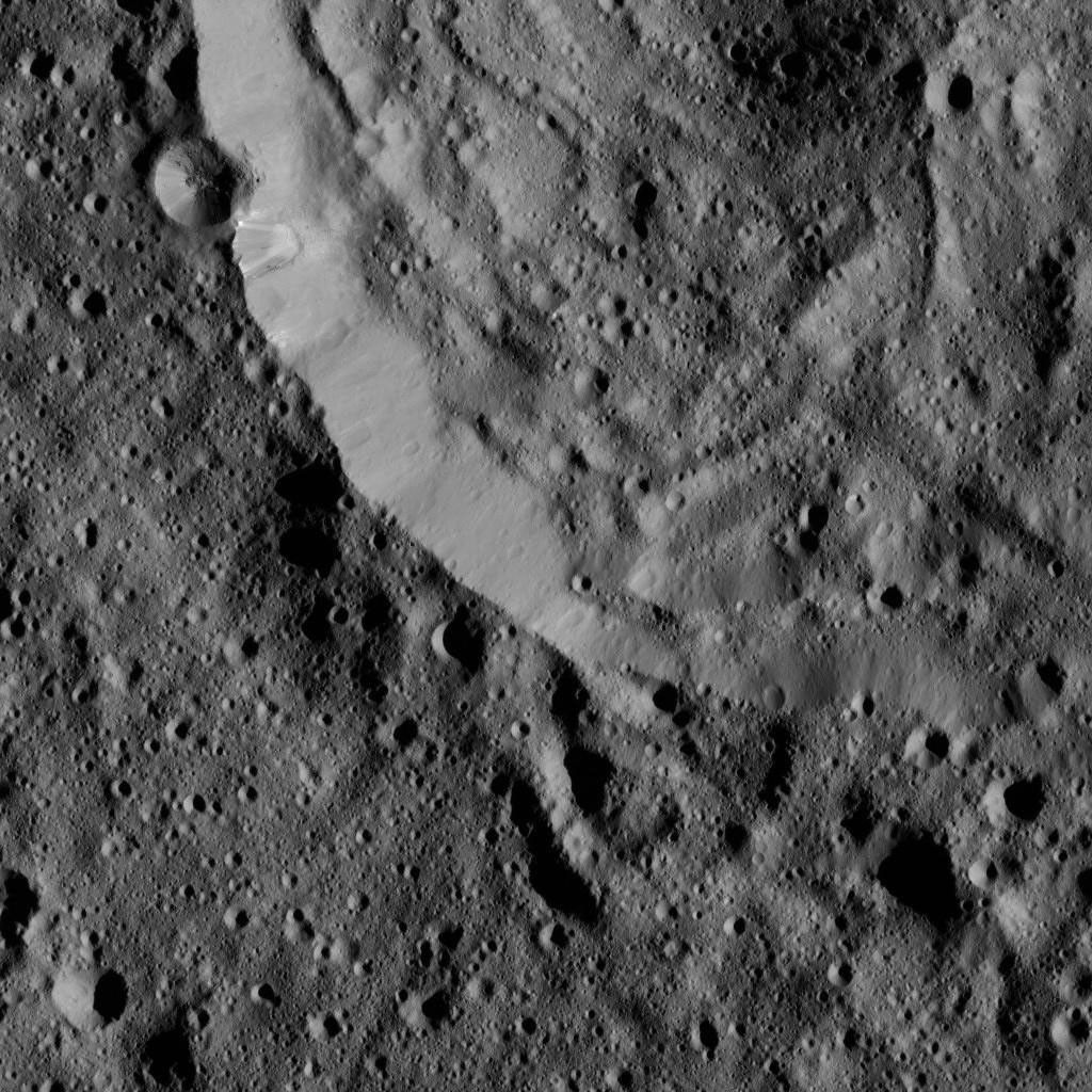 This view from NASA's Dawn spacecraft shows the southwestern rim of Sintana Crater. The inside of the crater shows a hummocky surface.