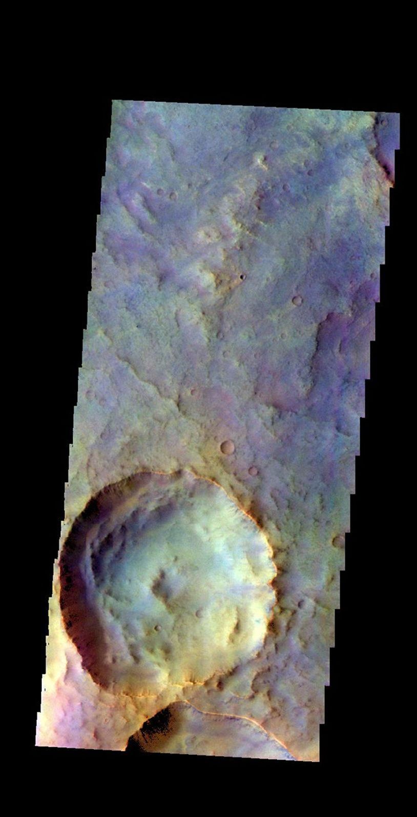 The THEMIS camera contains 5 filters. The data from different filters can be combined in multiple ways to create a false color image. This image from NASA's 2001 Mars Odyssey spacecraft shows an unnamed crater in Terra Sabaea.