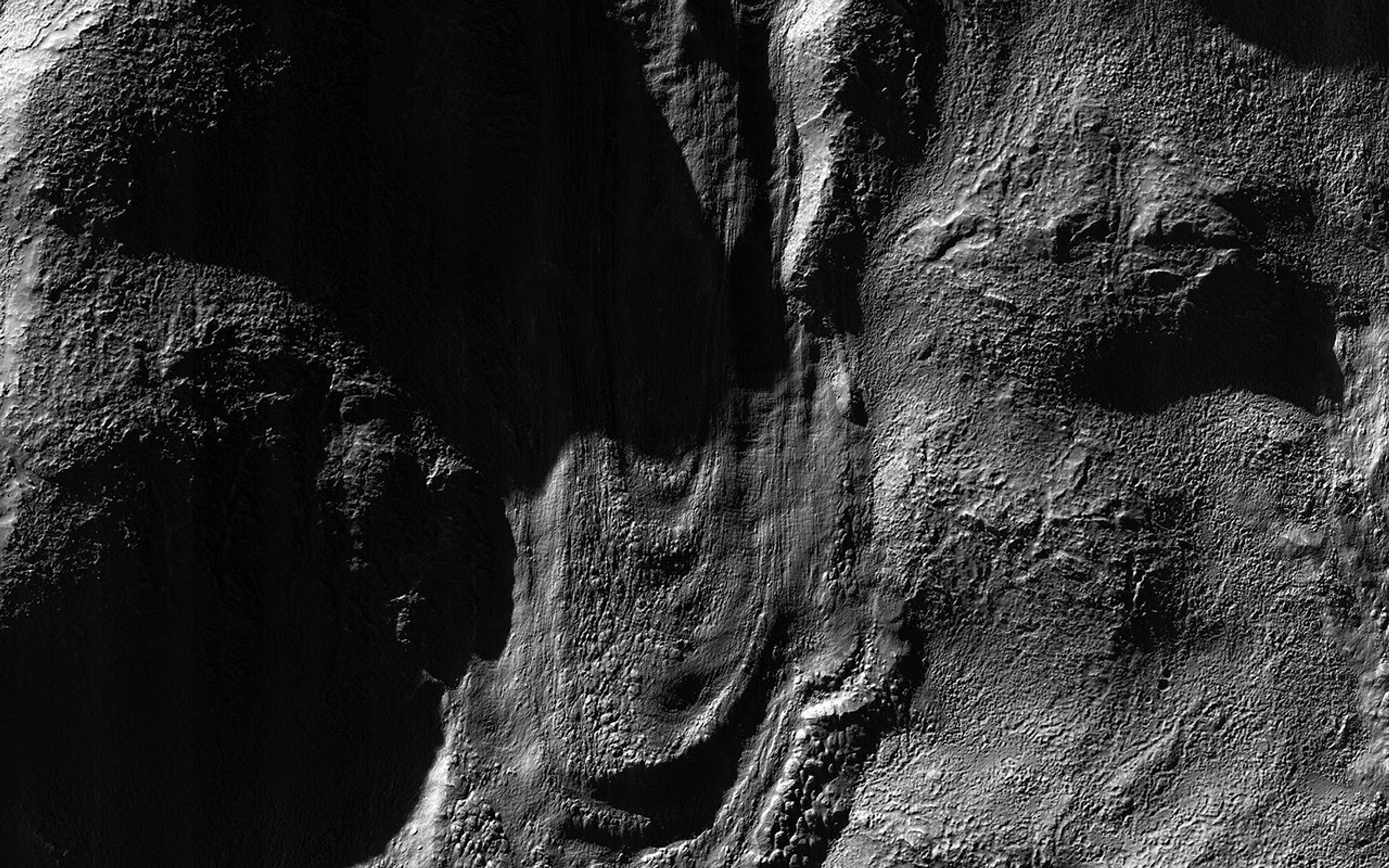 This image from NASA's Mars Reconnaissance Orbiter spacecraft was acquired near the Martian winter solstice, when the sun was low over the horizon at this location.