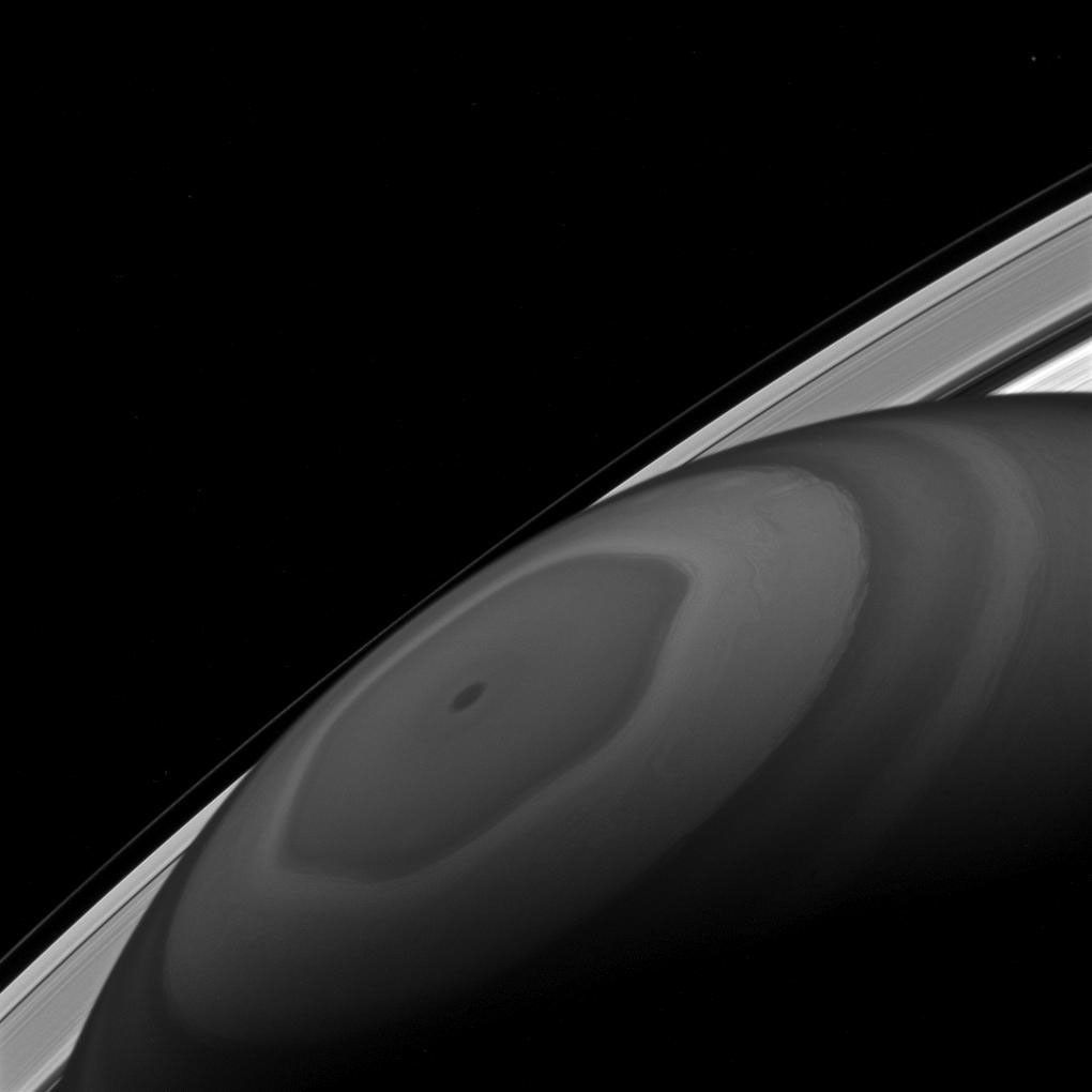 The north pole of Saturn sits at the center of its own domain. Around it swirl the clouds, driven by the fast winds of Saturn, as seen by NASA's Cassini spacecraft.