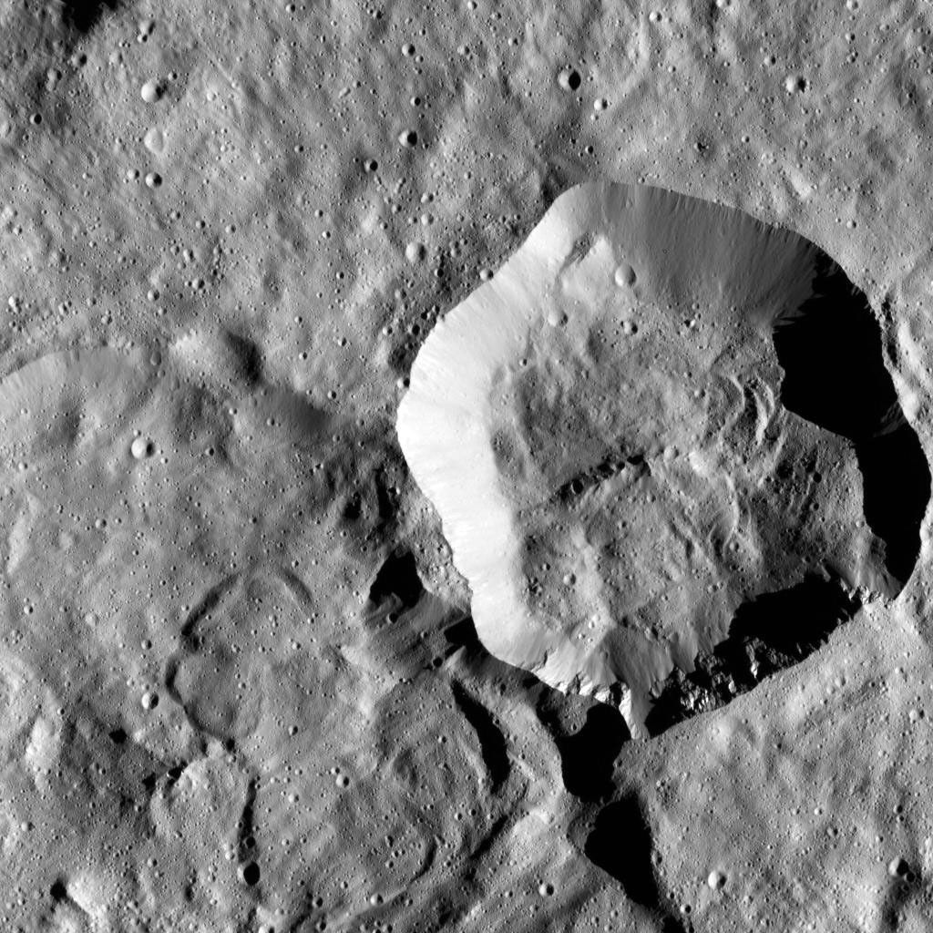 In this image of Ceres from NASA's Dawn spacecraft, a younger, fresher crater lies to next to the older, larger crater named Messor. Messor, which is named for the Roman god of the harvesting and cutting of grain.