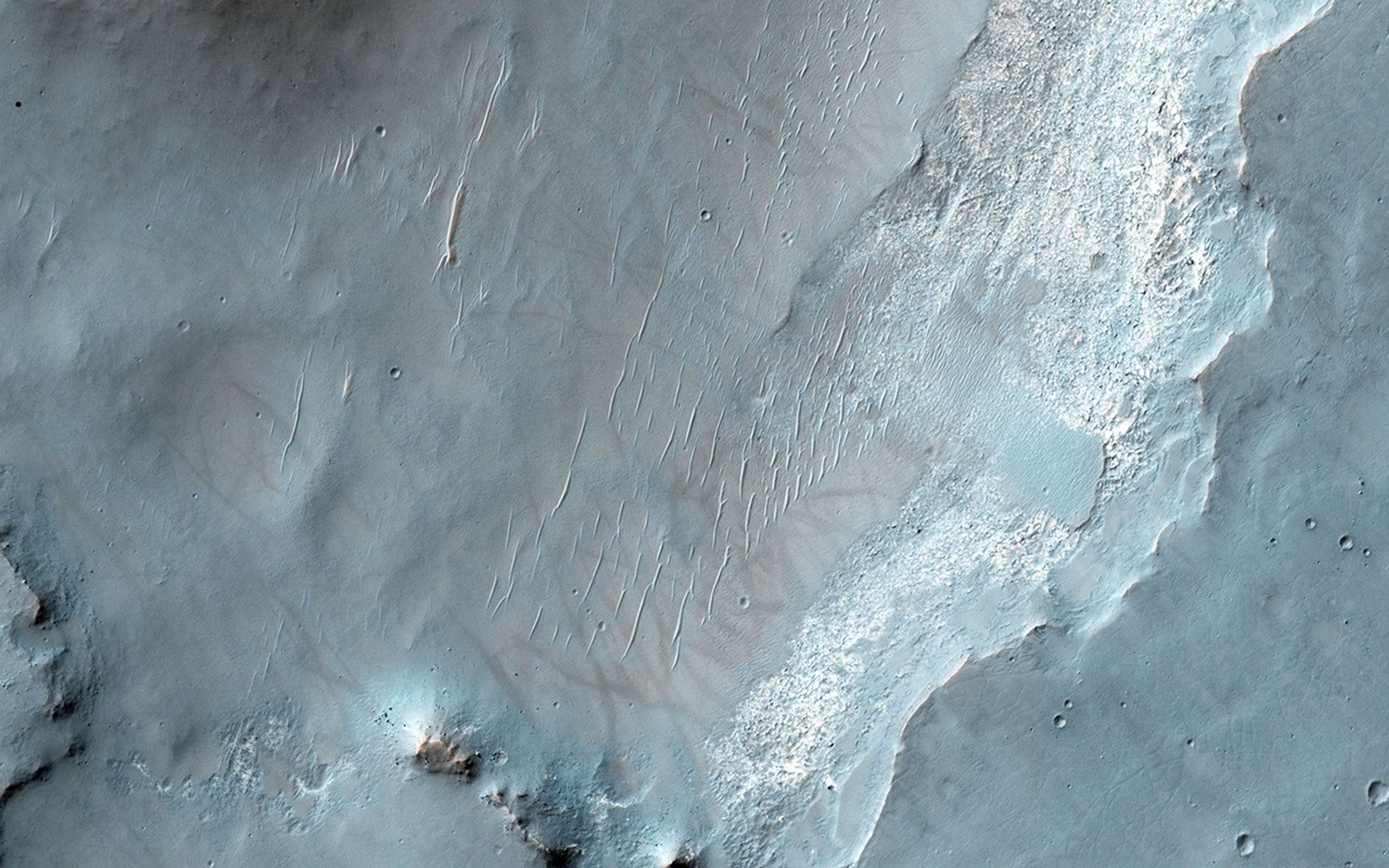 This image from NASA's Mars Reconnaissance Orbiter spacecraft shows an exposure of bedrock on the floor of Bakhuysen Crater, an impact crater in Noachis Terra. The bedrock is highly fragmented and fractured.
