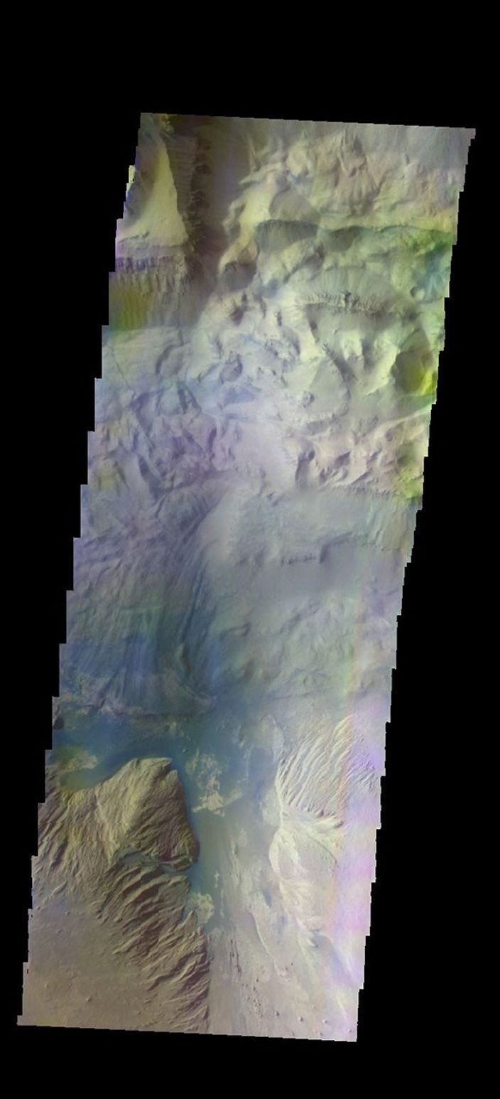 The THEMIS camera contains 5 filters. The data from different filters can be combined in multiple ways to create a false color image. This image from NASA's 2001 Mars Odyssey spacecraft shows part of Ophir Chasma.