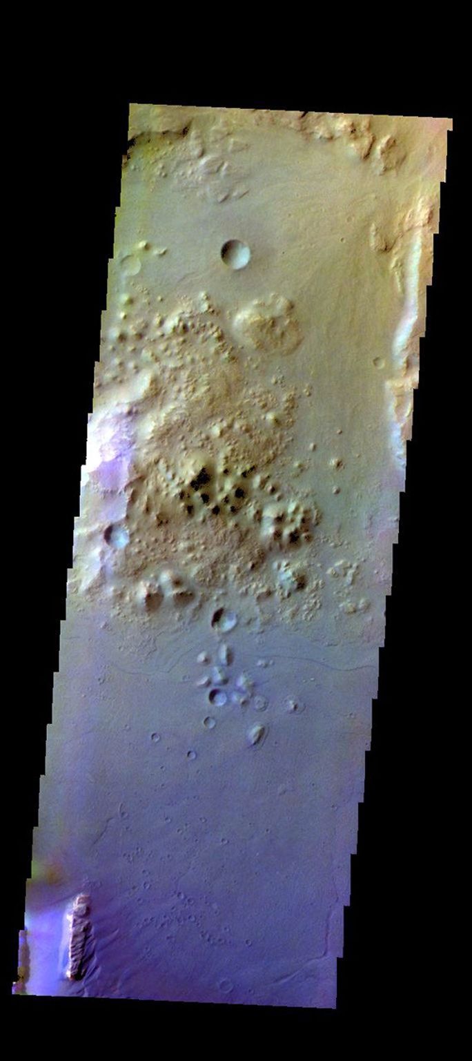 The THEMIS camera contains 5 filters. The data from different filters can be combined in multiple ways to create a false color image. This image from NASA's 2001 Mars Odyssey spacecraft shows part of Ganges Chasma.