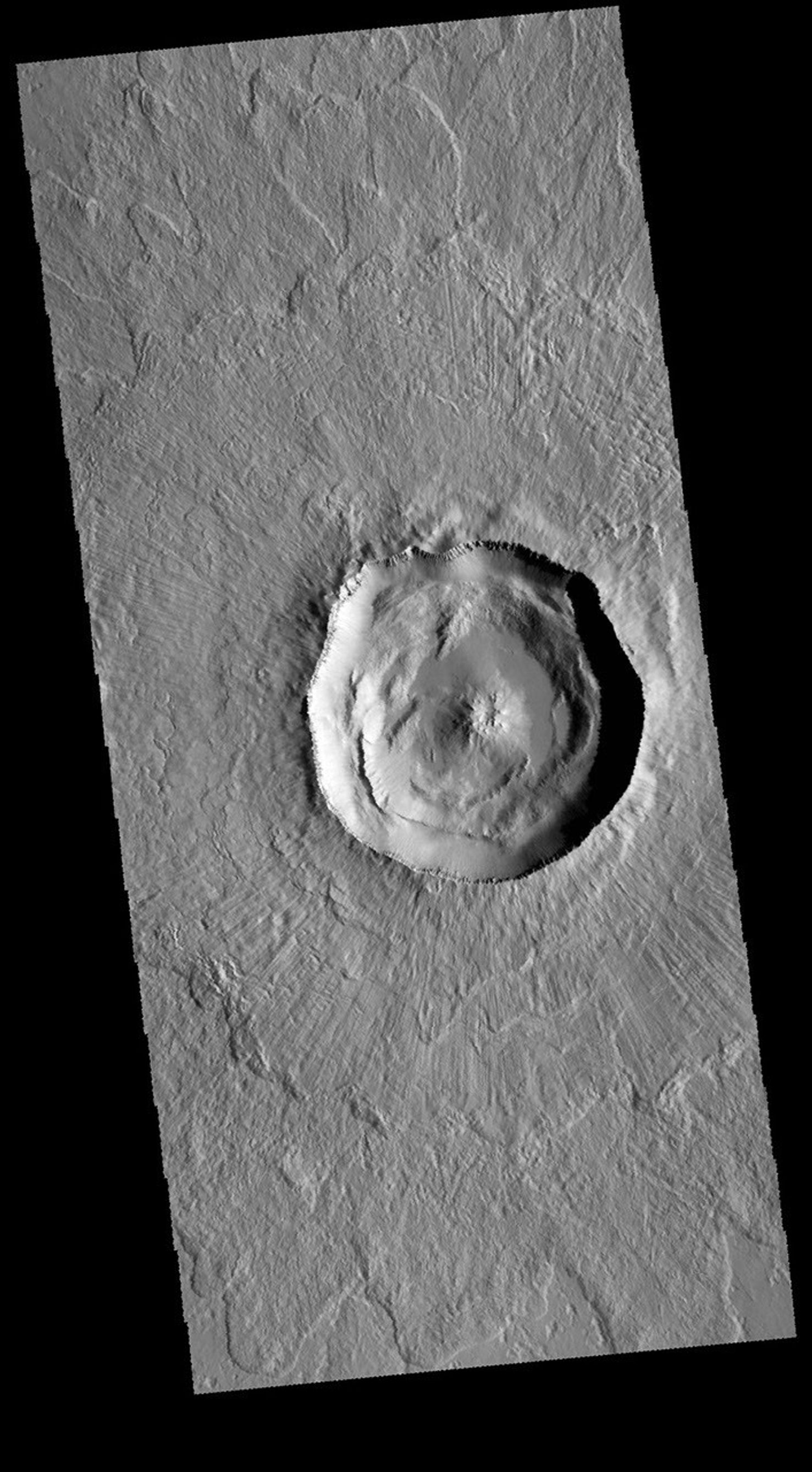 This image captured by NASA's 2001 Mars Odyssey spacecraft shows Steinheim Crater, located in Arcadia Planitia.