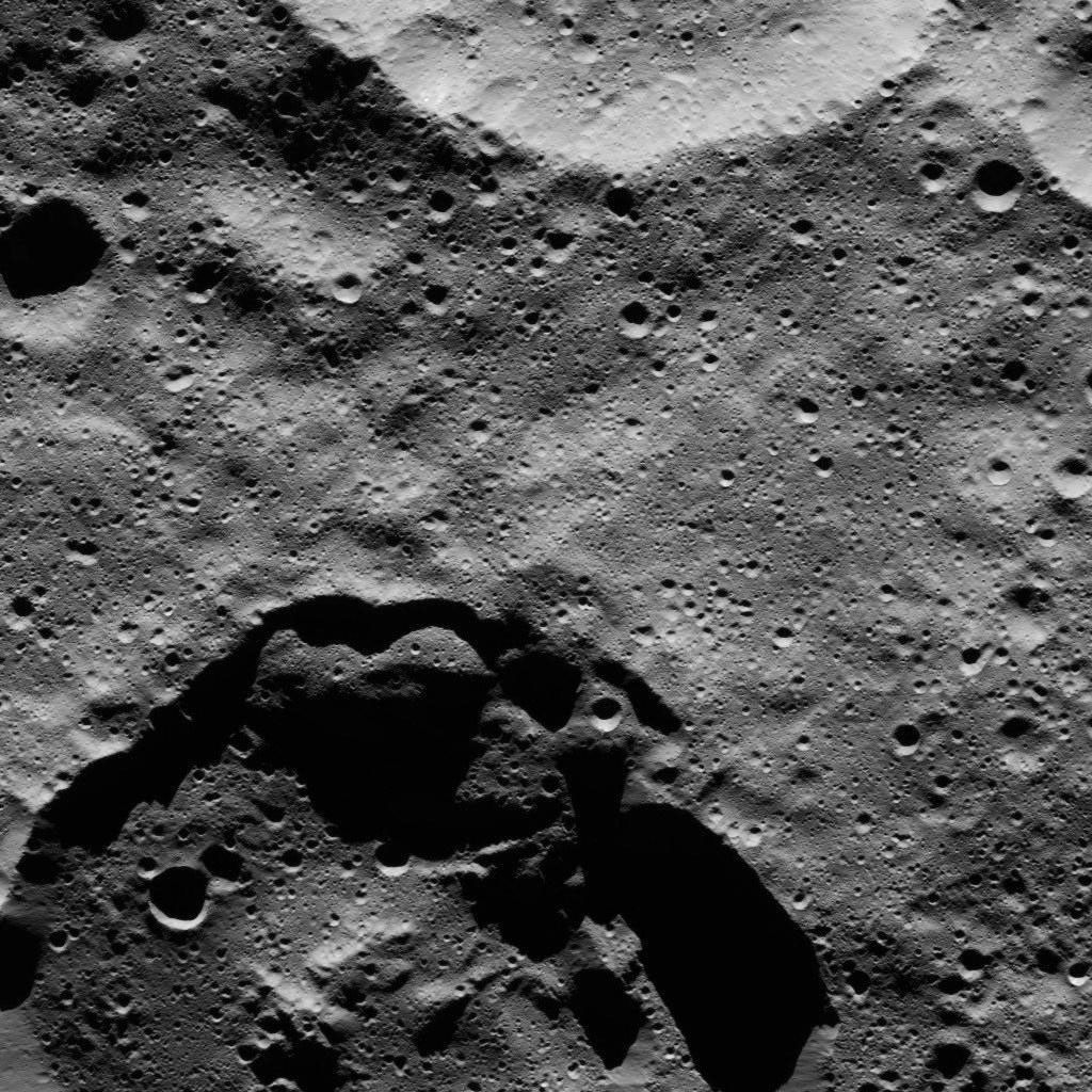 This view from NASA's Dawn spacecraft shows two medium-sized craters at high northern latitudes on Ceres.