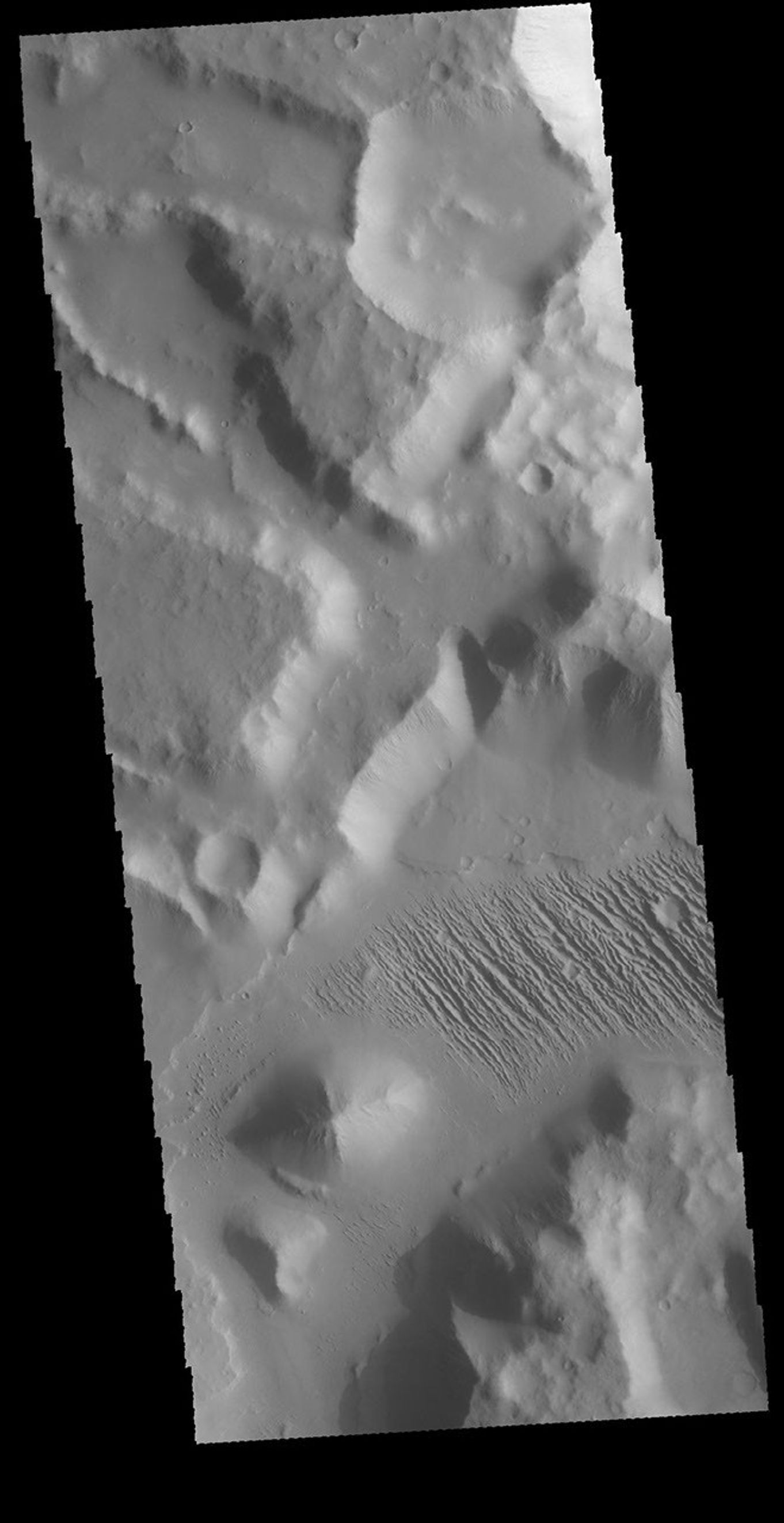 This image captured by NASA's 2001 Mars Odyssey spacecraft is located in Aeolis Mensae, east of Gale Crater.