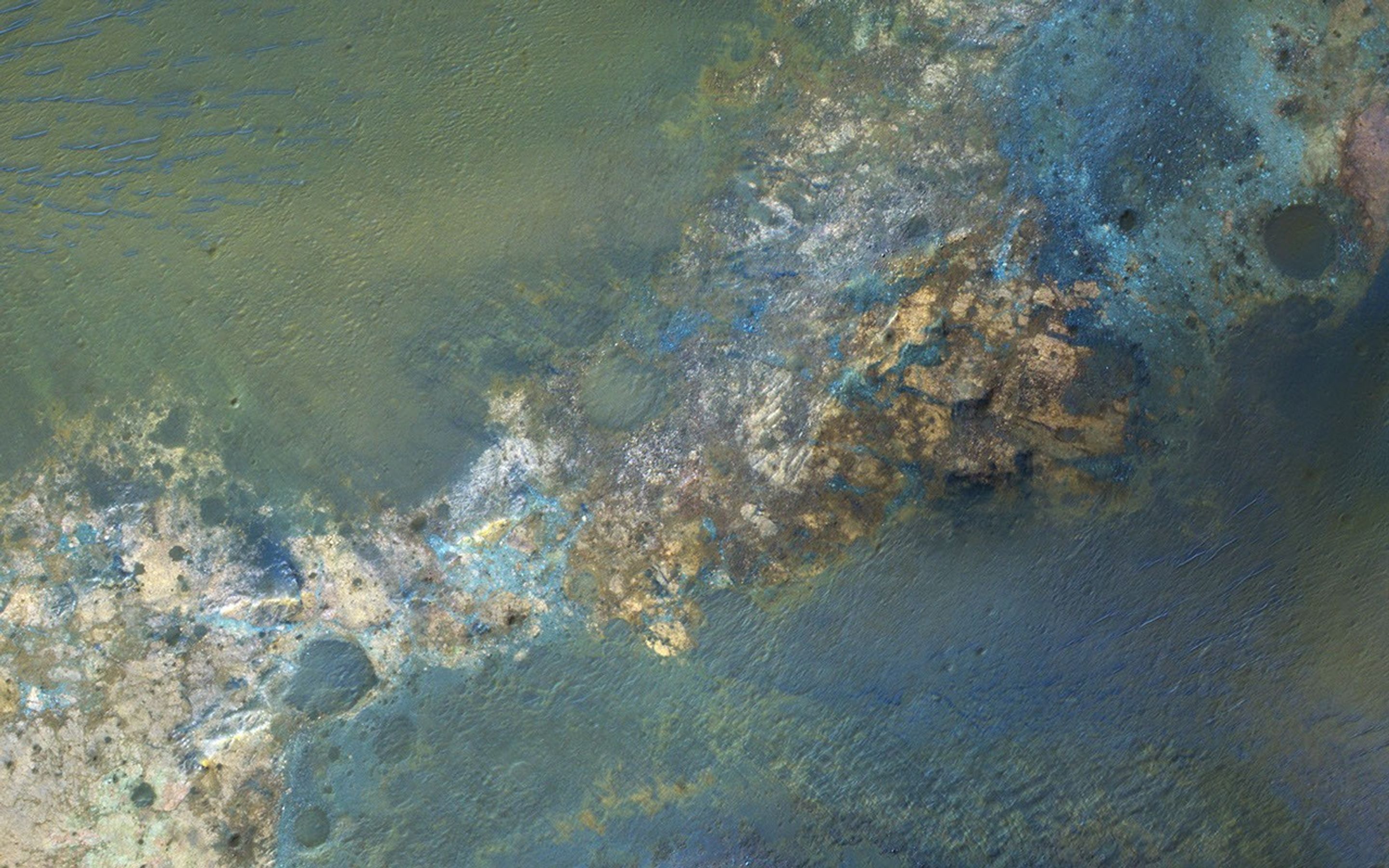 Large impact craters rebound from the initial shock, raising deep bedrock to the surface in the central uplift of the crater as seen by NASA's Mars Reconnaissance Orbiter spacecraft.