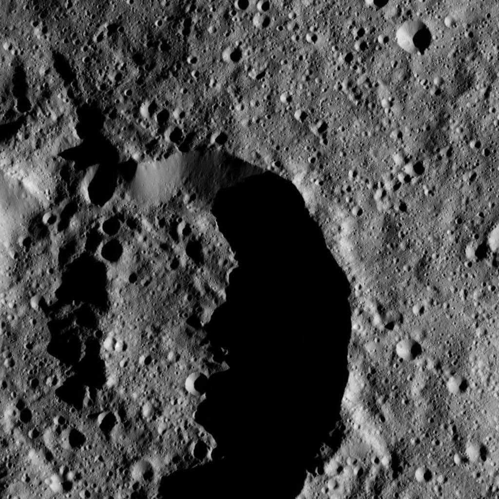 This image from NASA's Dawn spacecraft shows an unnamed impact feature that lies on the northern rim of Chaminuka Crater in Ceres' southern hemisphere.