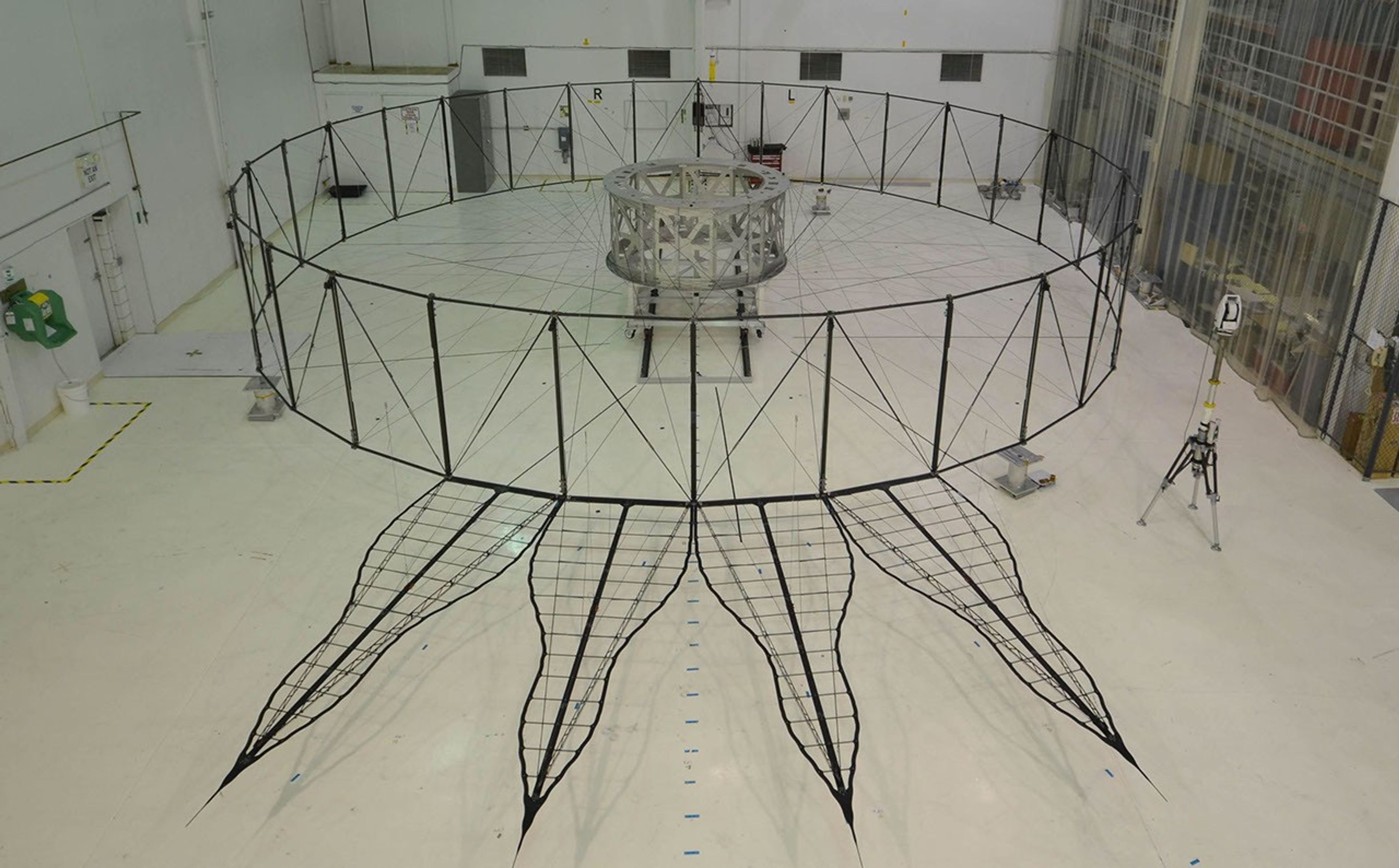 The four petals pictured in the image shows the bare bones of the first prototype starshade by NASA's JPL, being measured for this positional accuracy with a laser. As shown by this 66-foot model, starshades can come in many shapes and sizes.