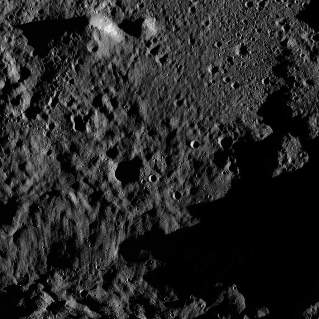 This view, taken on June 3, 2016, from NASA's Dawn spacecraft shows an area within the floor of the Mondamin impact basin, which lies in the southern hemisphere of Ceres. Mondamin Crater is about 78 miles (126 kilometers) in diameter.