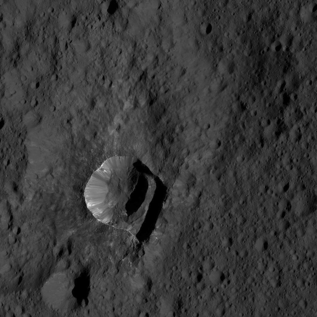 NASA's Dawn spacecraft views Oxo Crater (6 miles, 10 kilometers wide) in this view from Ceres, taken on June 4, 2016, from its low-altitude mapping orbit, at a distance of about 240 miles (385 kilometers) above the surface.