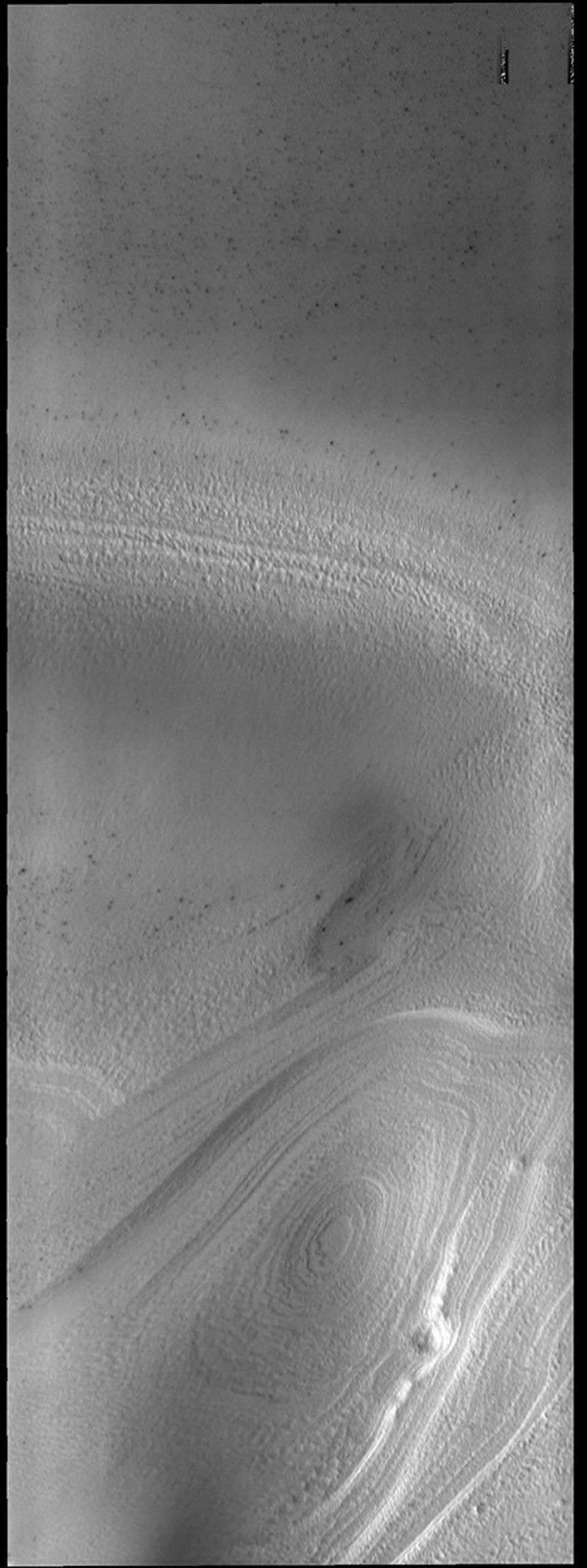 Southern hemisphere spring has arrived at the south polar cap. The ice layers that make up the cap are easily seen in this image from NASA's 2001 Mars Odyssey spacecraft.