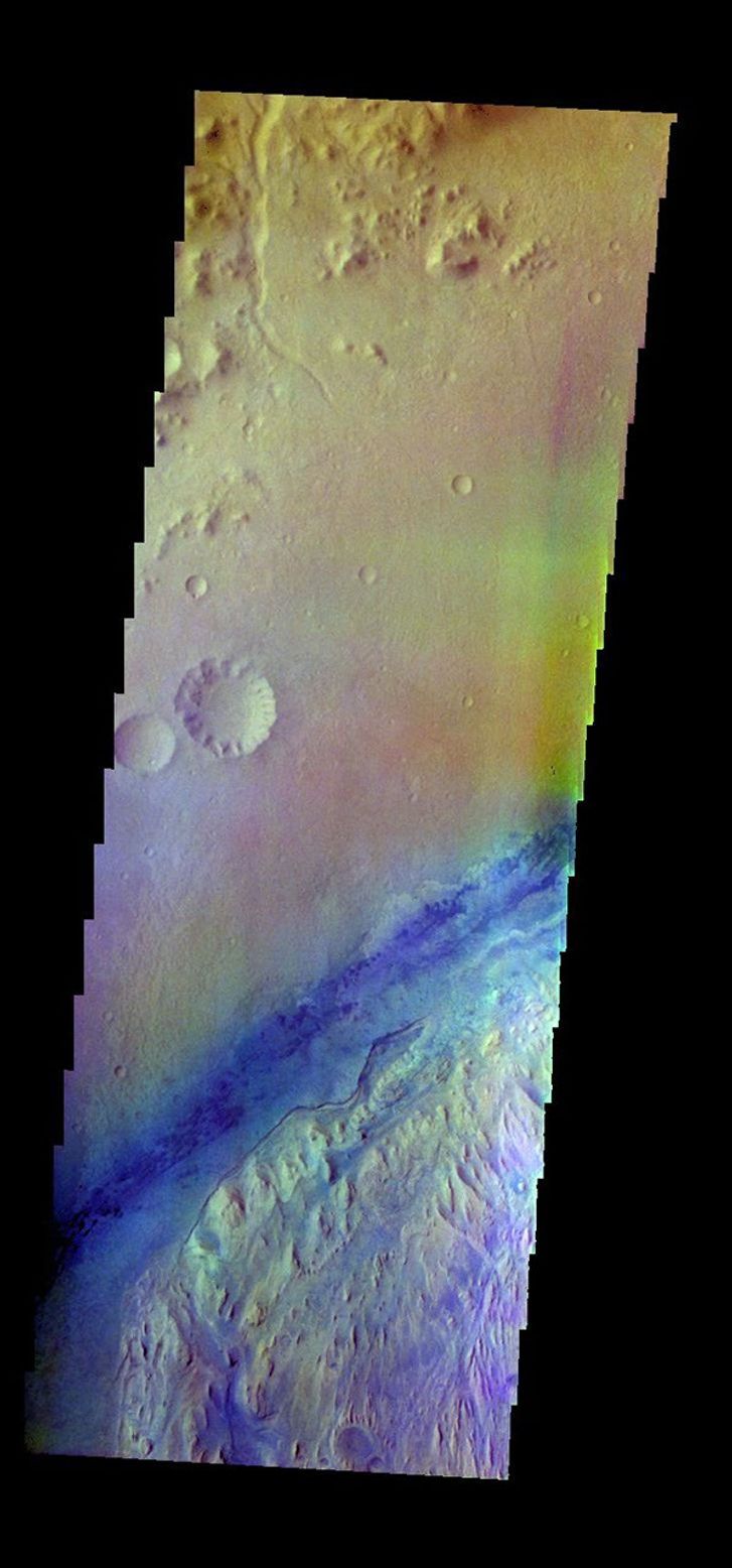 The THEMIS camera contains 5 filters. The data from different filters can be combined in multiple ways to create a false color image. This image from NASA's 2001 Mars Odyssey spacecraft shows part of Gale Crater.