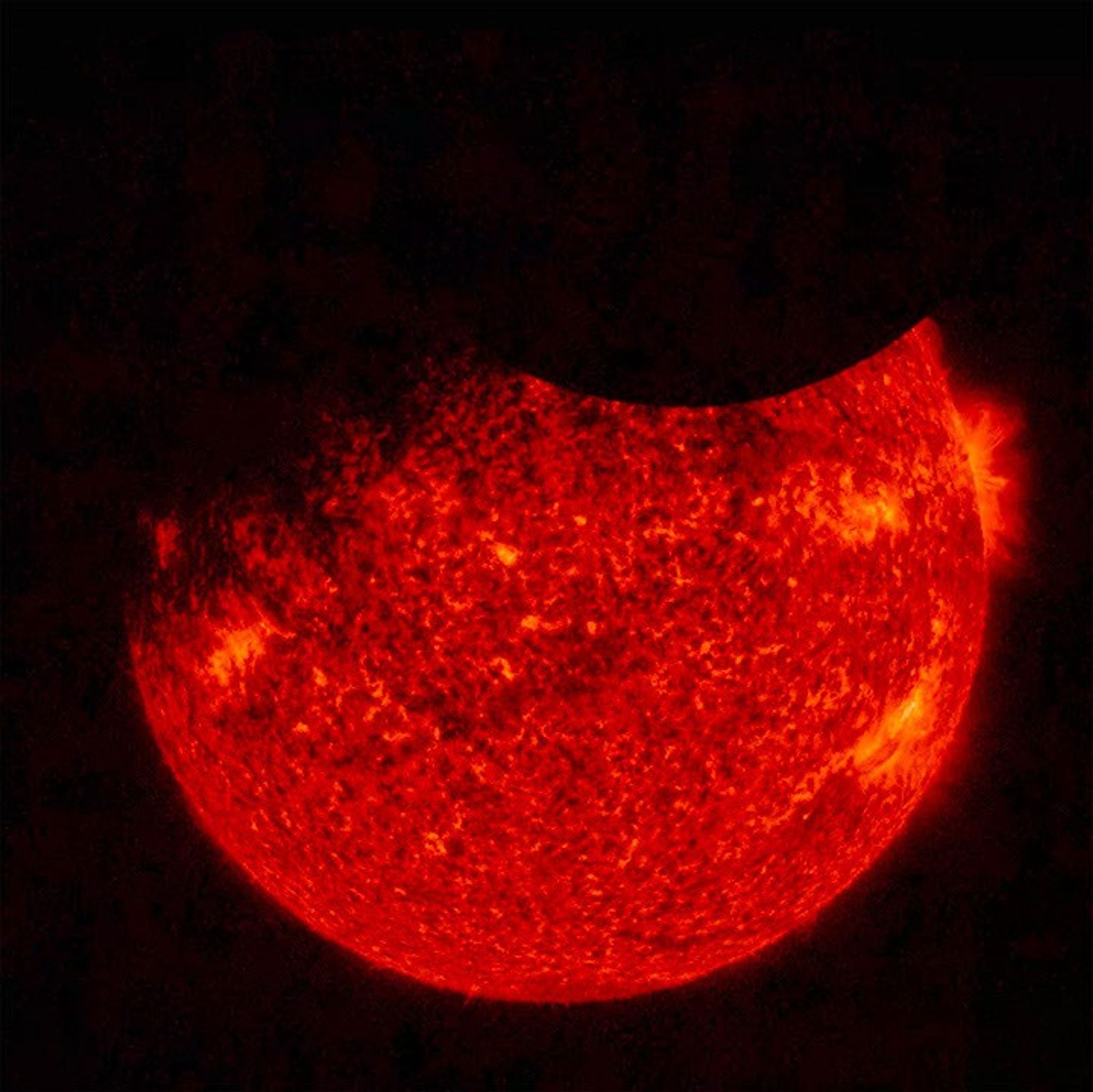 NASA's Solar Dynamics Observatory (SDO) saw both the Moon (upper right) and the Earth (upper left) partially block the sun (Sept. 1, 2016 at 7:33 UT). Just before this image was taken, the Earth totally blocked the sun for a while.