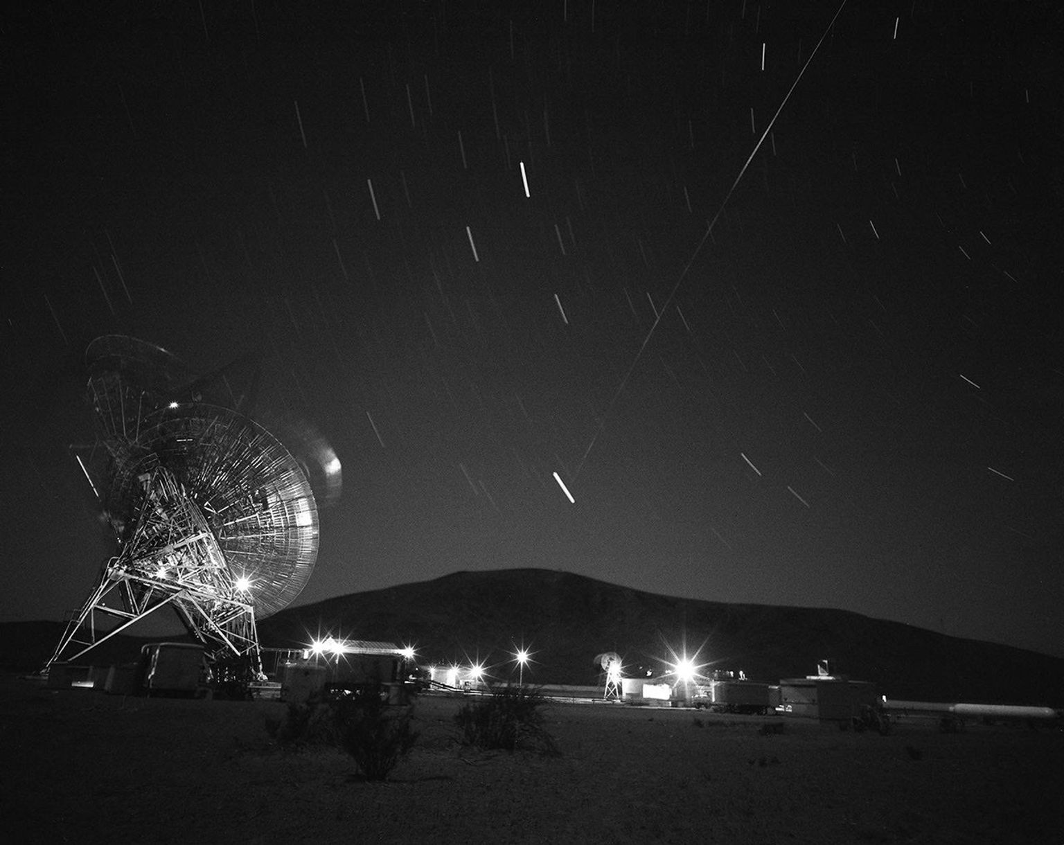 This archival photograph shows the first pass of Echo 1, America's first communications satellite, over the Goldstone Tracking Station managed by NASA's Jet Propulsion Laboratory, in Pasadena, California, in the early morning of Aug. 12, 1960.