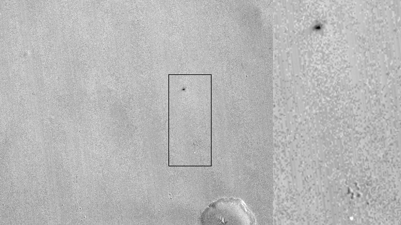 This image from NASA's Mars Reconnaissance Orbiter shows one of two spots that likely appeared in connection with the Oct. 19, 2016, arrival of ESA's Schiaparelli test lander. An animation is available at the Photojournal.