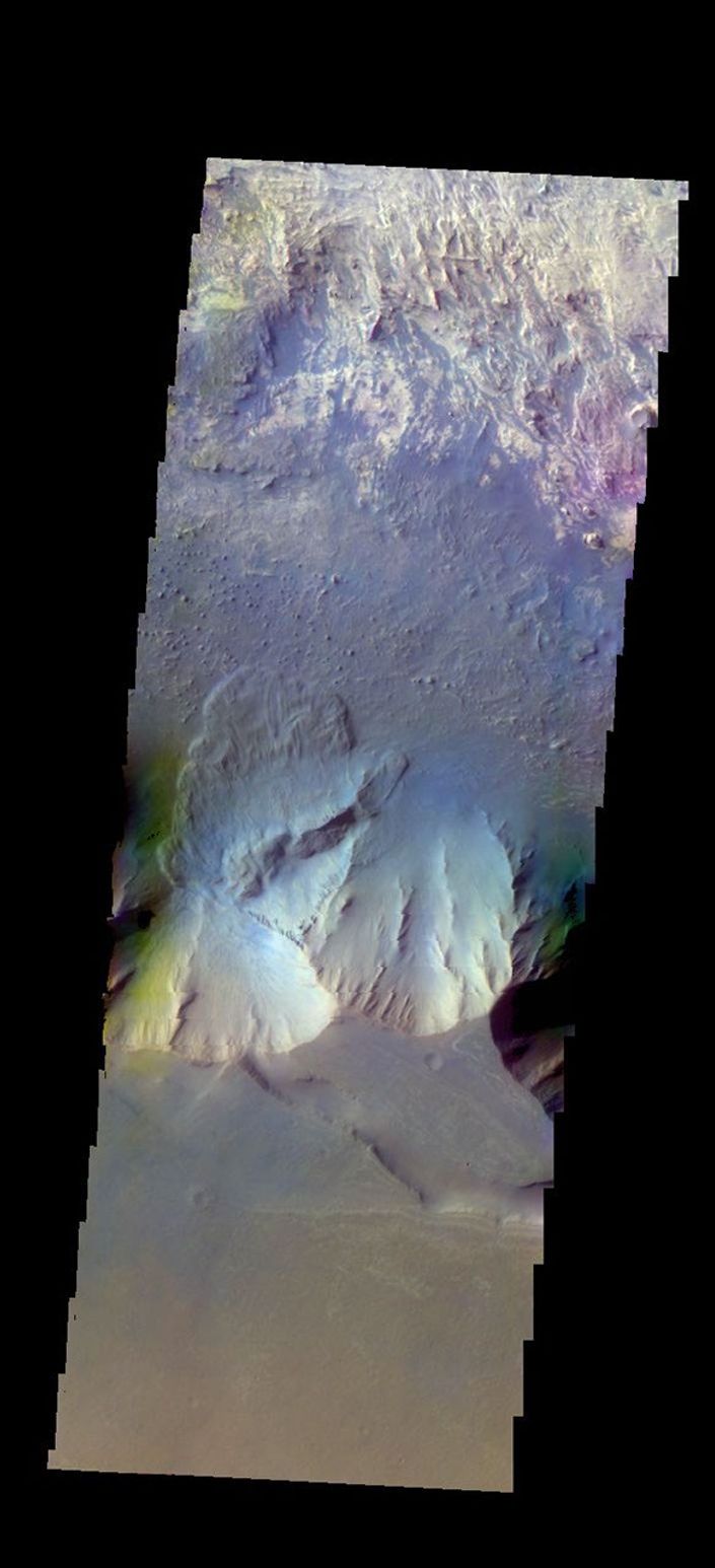 The THEMIS camera contains 5 filters. The data from different filters can be combined in multiple ways to create a false color image. This image from NASA's 2001 Mars Odyssey spacecraft shows part of Candor Chasma.