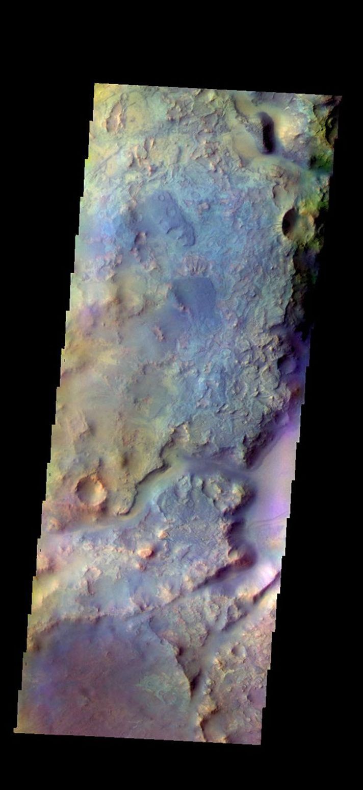 The THEMIS camera contains 5 filters. The data from different filters can be combined in multiple ways to create a false color image. This image from NASA's 2001 Mars Odyssey spacecraft shows part of Nili Fossae.