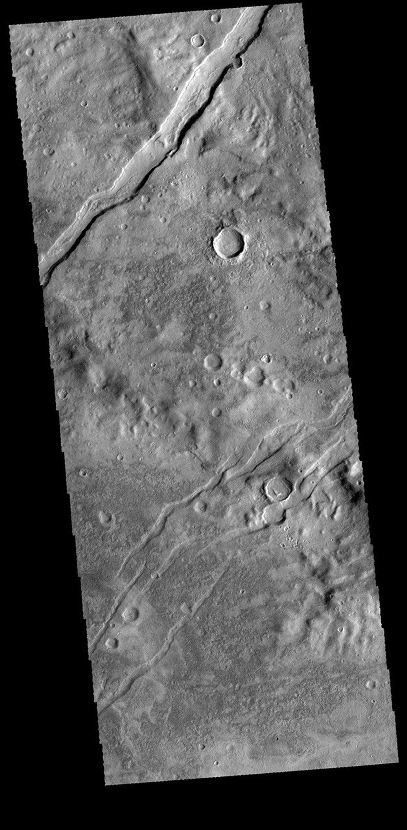 The channel-like features in this image from NASA's 2001 Mars Odyssey spacecraft are tectonic graben. The graben (called Icaria Fossae) are located in Terra Sirenum.