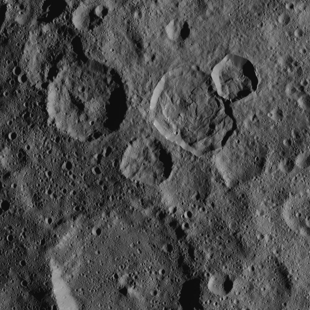 This northern hemisphere scene from NASA's Dawn spacecraft, taken on Oct. 20, 2016, features Ceres' Messor Crater, exhibiting a flow feature from the collapse of the rim of an adjacent crater.