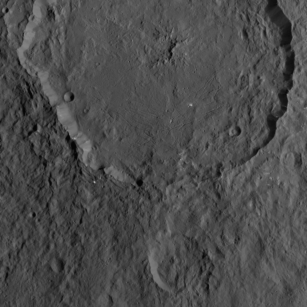Dantu Crater on Ceres, at top center, is featured in this image from NASA's Dawn spacecraft taken on Oct. 21, 2016. A small crater located around the 5 o'clock position within Dantu is called Centeotl.
