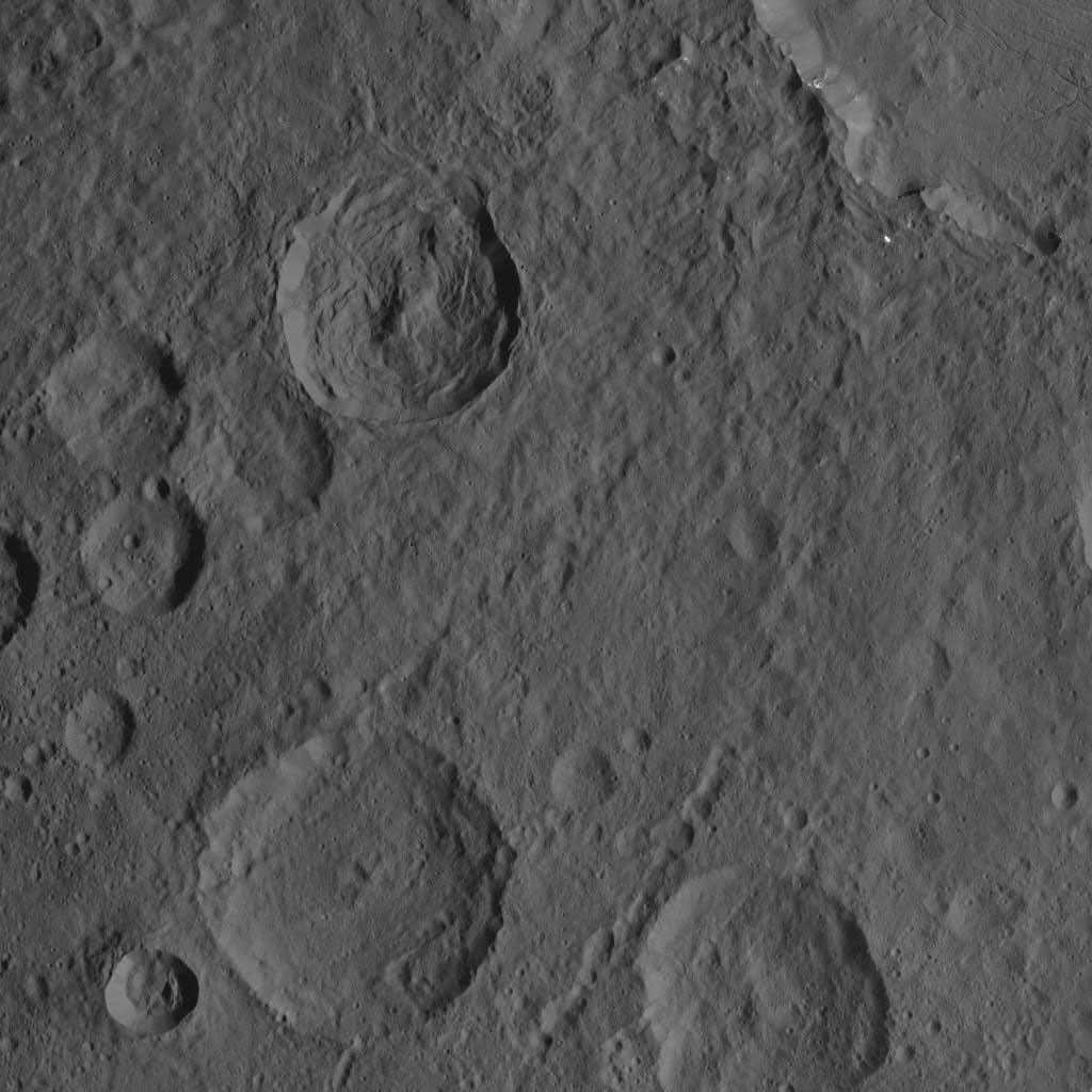 This scene captured by NASA's Dawn spacecraft on Oct. 21, 2016, from Ceres' northern hemisphere shows part of the rim of Dantu Crater, at top right. Rao Crater is the largest crater in the bottom left corner of the image.