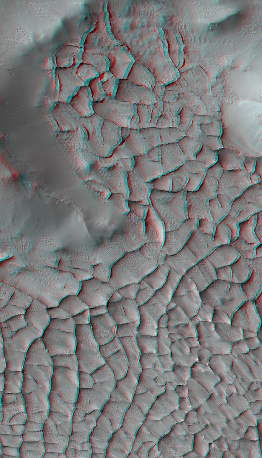 This anaglyph from NASA's Mars Reconnaissance Orbiter shows part of Gordi Dorsum in the Medusae Fossae region of Mars, shows part of an area on Mars where narrow rock ridges, some as tall as a 16-story building.