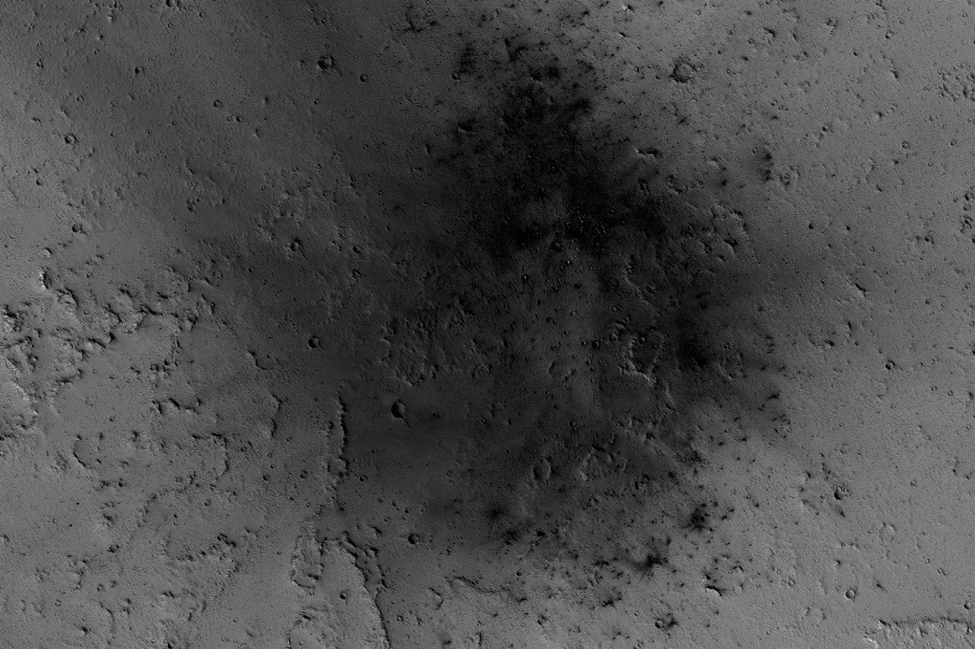 NASA's Mars Reconnaissance Orbiter has been observing Mars in sharp detail for more than a decade, enabling it to document many types of changes, such as the way winds alter the appearance of this recent impact site.