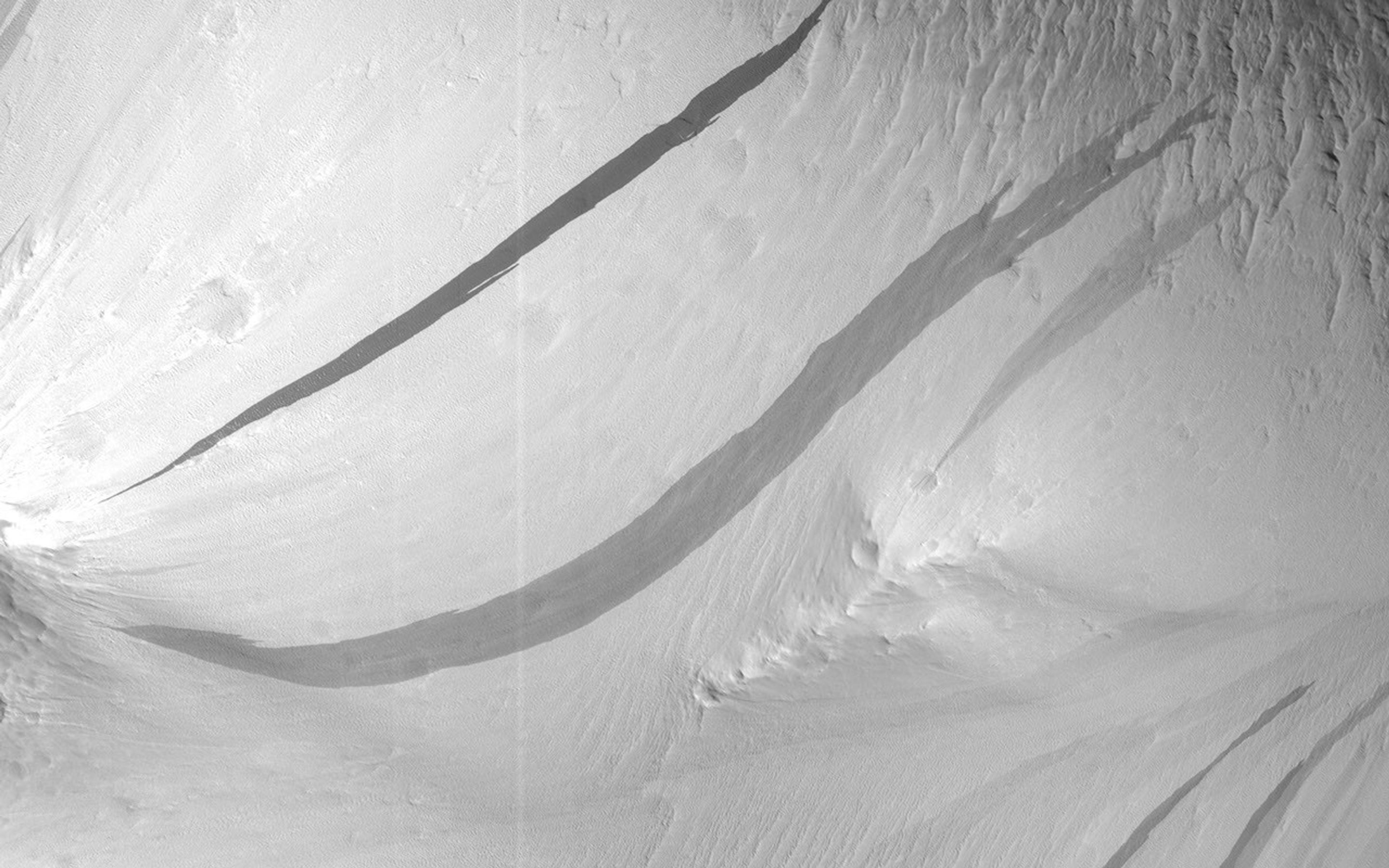 The image from NASA's Mars Reconnaissance Orbiter, shows a region we see many slope streaks, typically dark features on slopes in the equatorial regions on Mars.