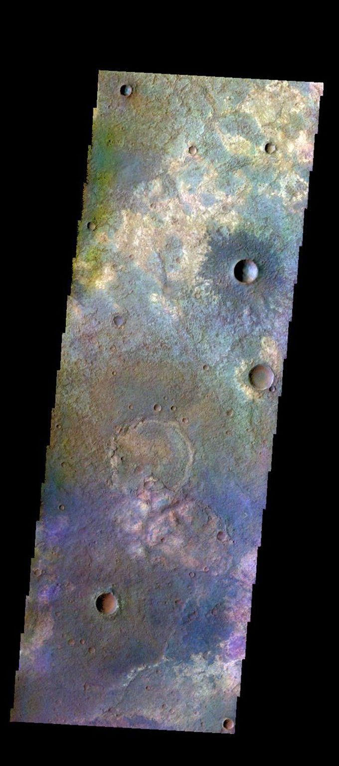 The THEMIS camera contains 5 filters. The data from different filters can be combined in multiple ways to create a false color image. This image from NASA's 2001 Mars Odyssey spacecraft shows some of the extensive plains that comprise Terra Sabaea.