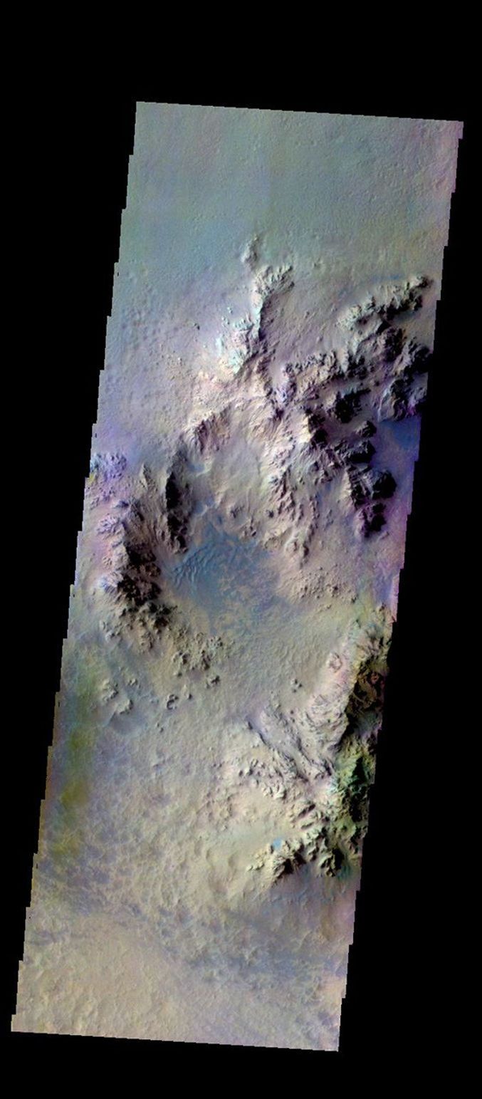 The THEMIS camera contains 5 filters. The data from different filters can be combined in multiple ways to create a false color image. This image from NASA's 2001 Mars Odyssey spacecraft shows part of the interior of Hale Crater.