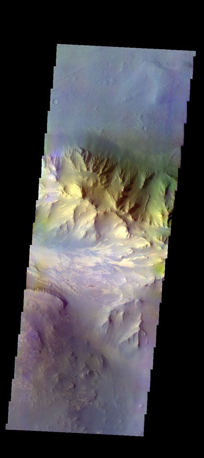The THEMIS camera contains 5 filters. The data from different filters can be combined in multiple ways to create a false color image. This image from NASA's 2001 Mars Odyssey spacecraft shows part of Coprates Chasma.