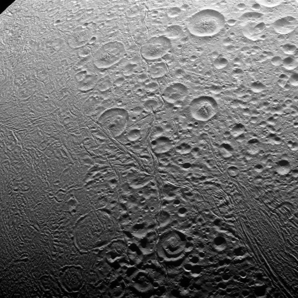The north polar area of Enceladus, seen in this image captured by NASA's Cassini spacecraft, is heavily cratered, an indication that the surface has not been renewed since quite long ago. But the south polar region shows signs of intense geologic activity