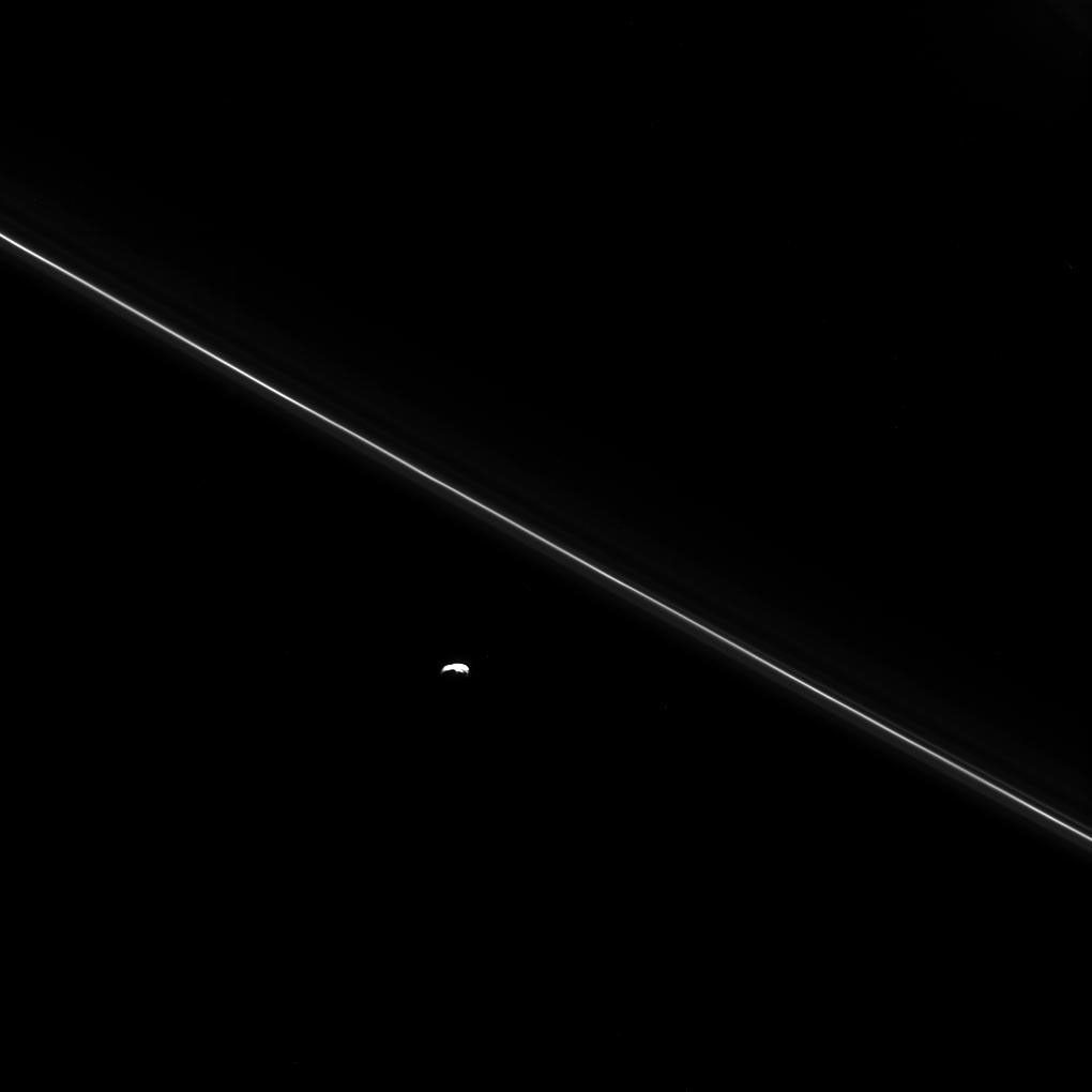As NASA's Cassini hurtled toward its fatal encounter with Saturn, the spacecraft turned to catch this final look at Saturn's moon Pandora next to the thin line of the F ring.
