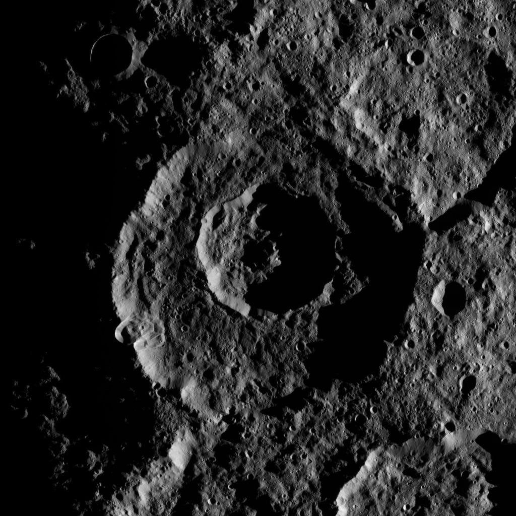 On Oct. 24, 2016, NASA's Dawn spacecraft captured the low angle of illumination bringing this pair of nested craters near Ceres' south pole into sharp relief.