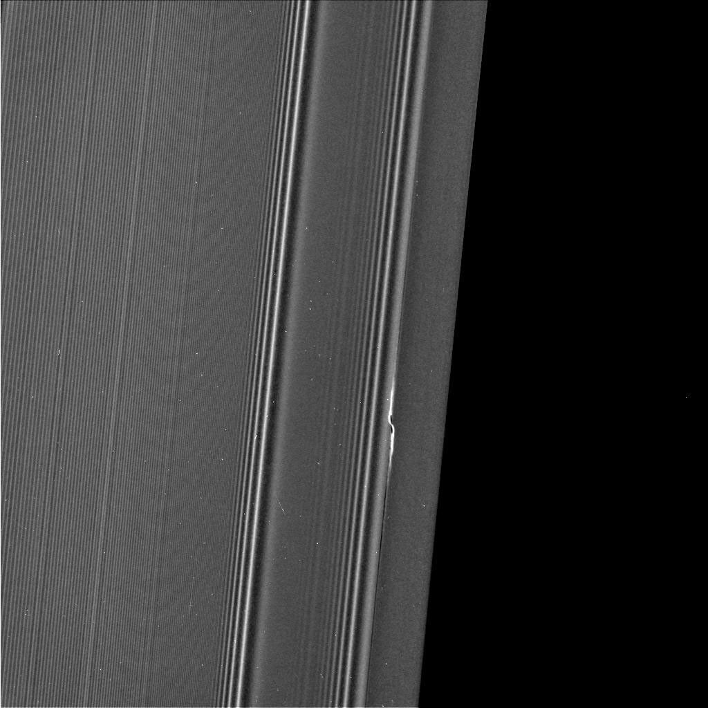 The propeller informally named 'Earhart' is seen in this view from NASA's Cassini spacecraft at much higher resolution than ever before. In this view, half of the Encke Gap is visible as the dark region at right.