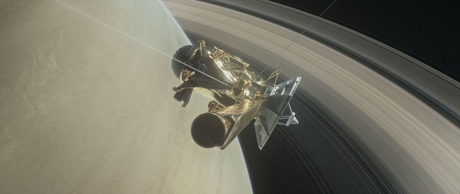 This illustration shows NASA's Cassini spacecraft about to make one of its dives between Saturn and its innermost rings as part of the mission's Grand Finale.