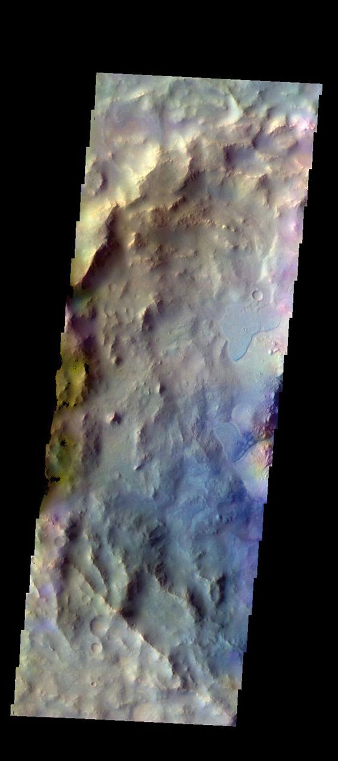 The THEMIS camera contains 5 filters. Data from different filters can be combined in multiple ways to create a false color image. This image from NASA's 2001 Mars Odyssey spacecraft shows part of Elorza Crater located in Ophir Planum.