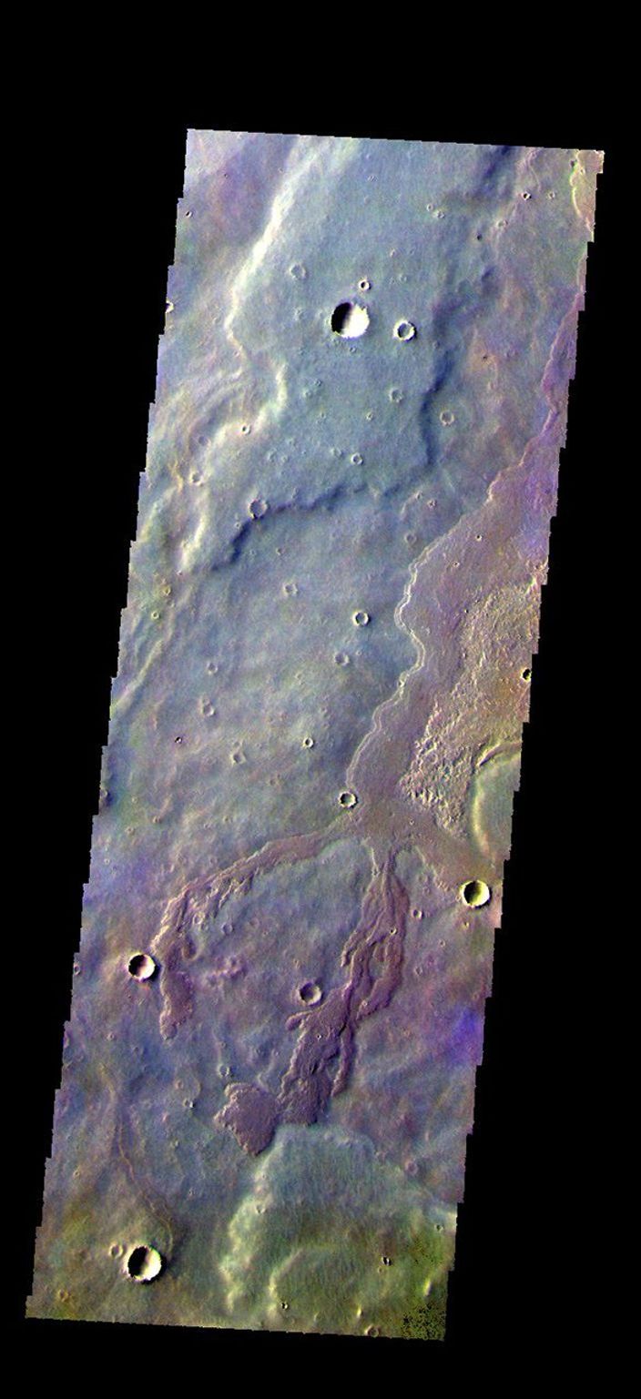 The THEMIS camera contains 5 filters. The data from different filters can be combined in multiple ways to create a false color image. This image from NASA's 2001 Mars Odyssey spacecraft shows a small portion of Daedalia Planum.