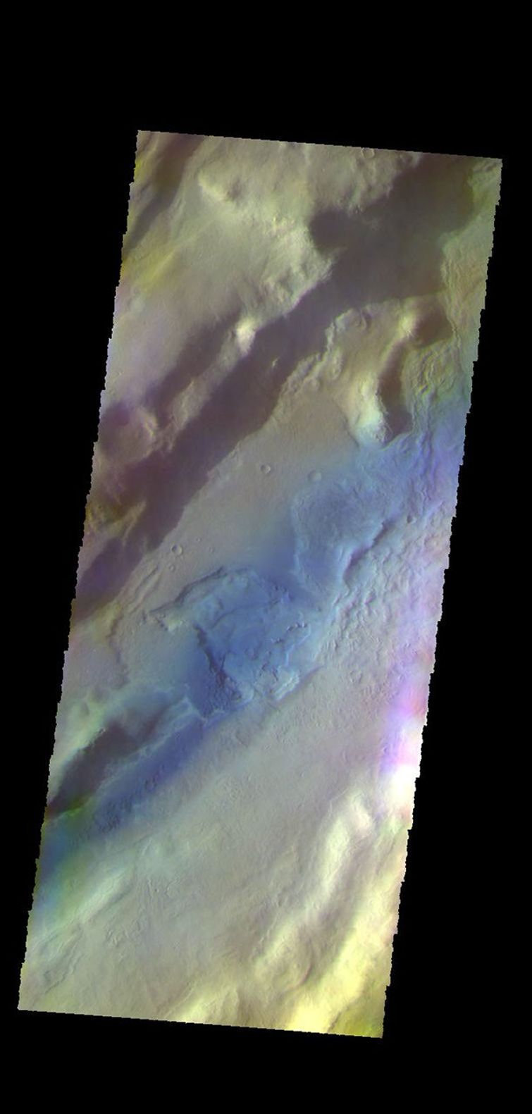 The THEMIS camera contains 5 filters. The data from different filters can be combined in multiple ways to create a false color image. This image from NASA's 2001 Mars Odyssey spacecraft shows a section of Tempe Fossae located in Tempe Terra.