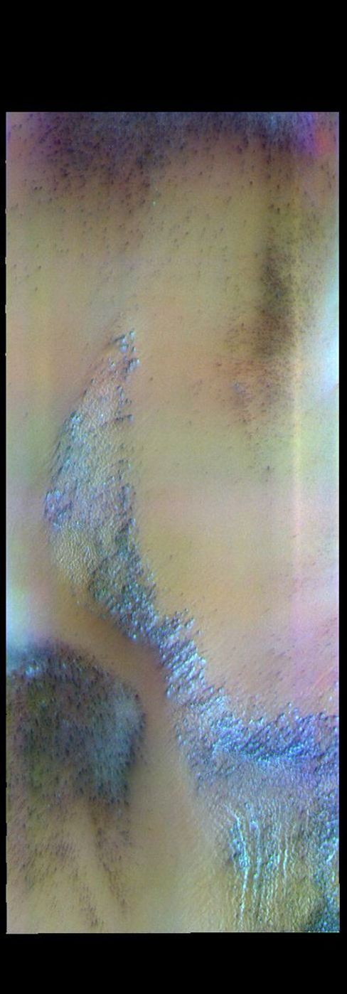 The THEMIS camera contains 5 filters. The data from different filters can be combined in multiple ways to create a false color image. This image from NASA's 2001 Mars Odyssey spacecraft shows a trough in the south polar cap.