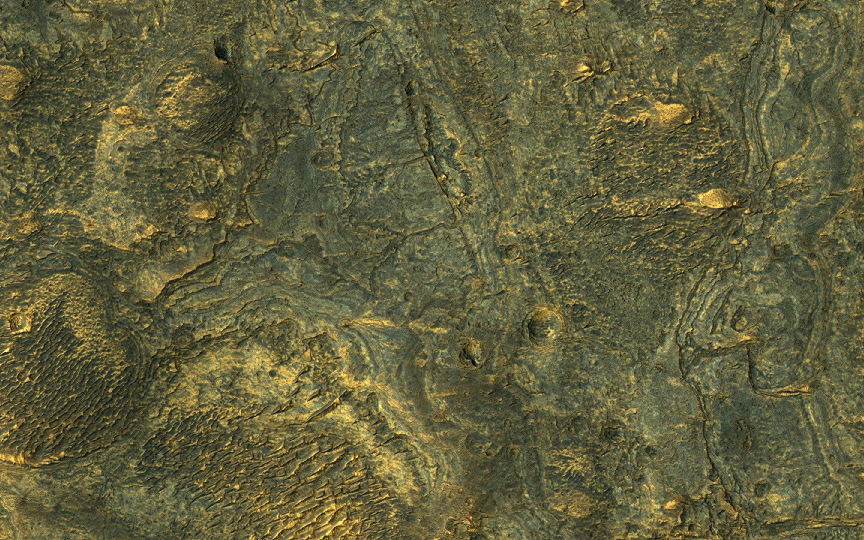 This enhanced-color sample from NASA's Mars Reconnaissance Orbiter reveals the incredible diversity of landforms on some Martian plains that appear bland and uniform at larger scales.