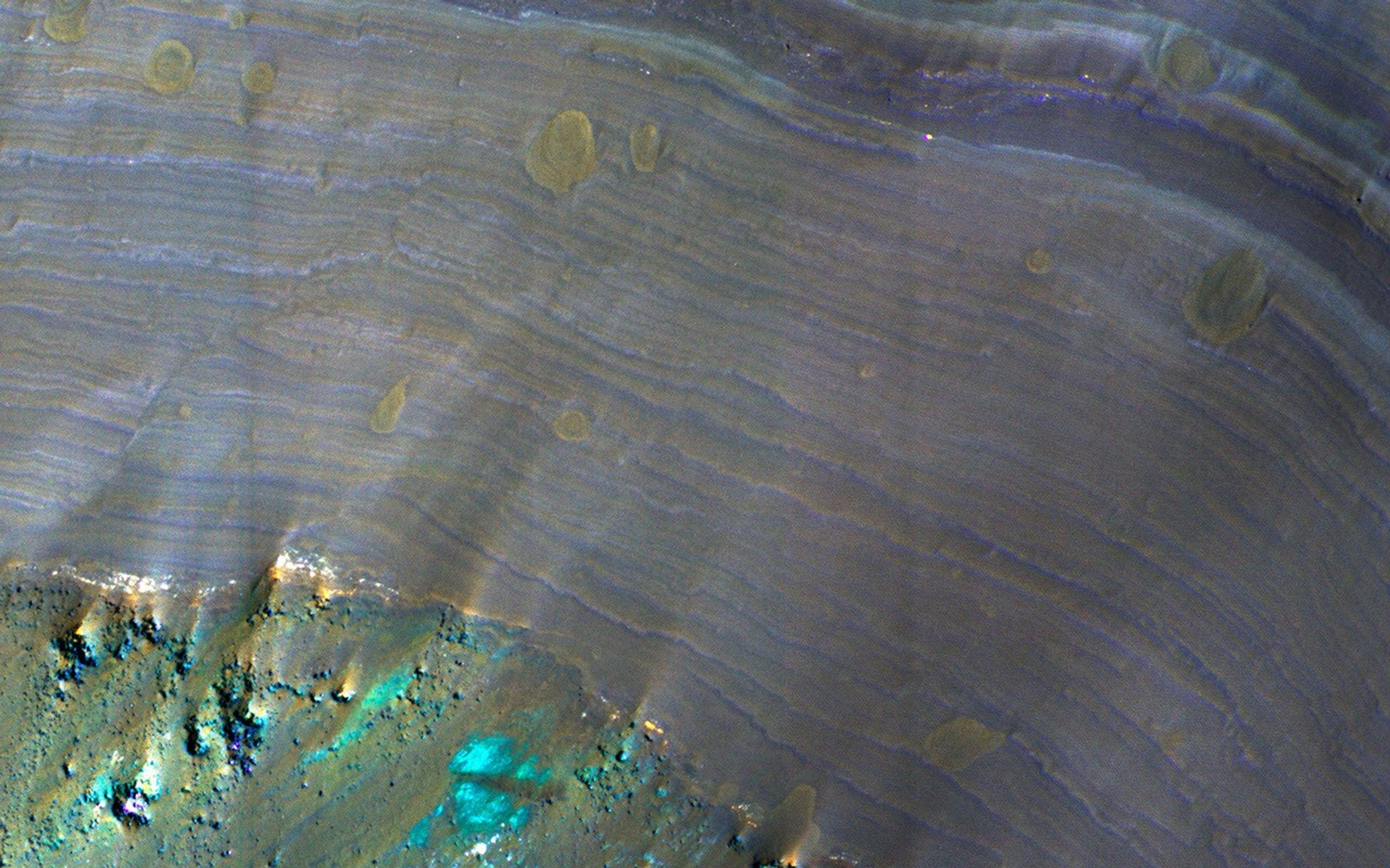 This image from NASA's Mars Reconnaissance Orbiter is of Saheki Crater, about 84 kilometers across, and located in the Southern highlands of Mars, to the north of Hellas Planitia.